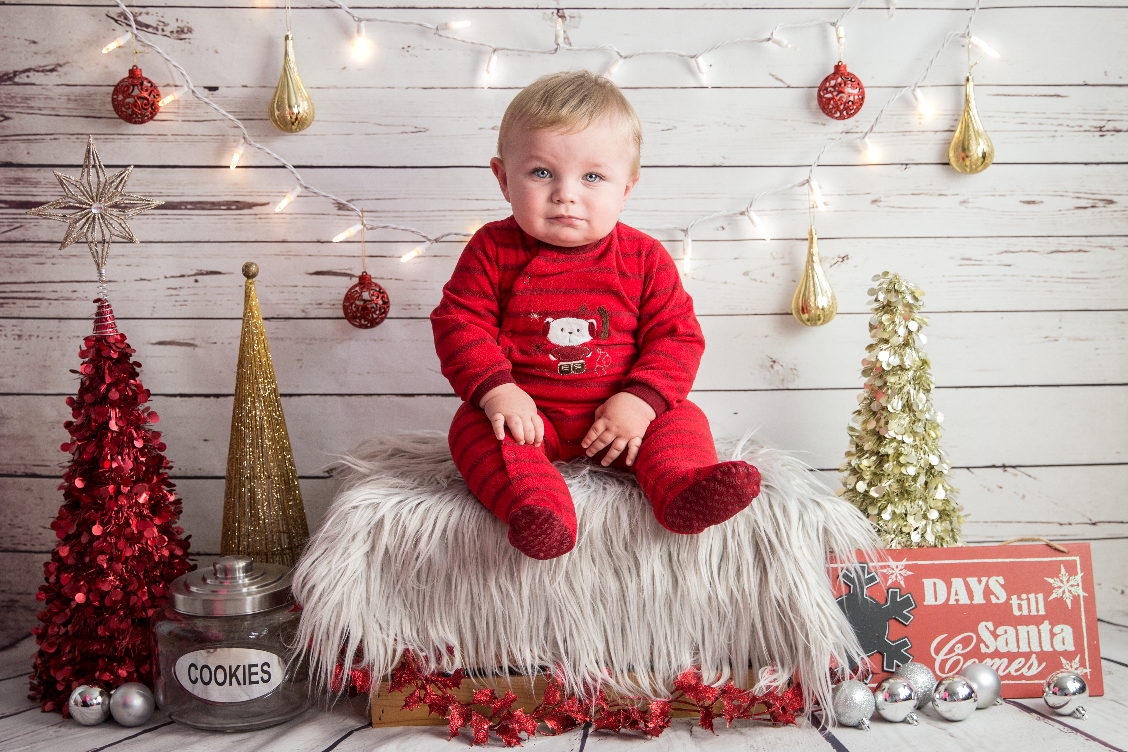 christmas mini back drop with grumpy little boy