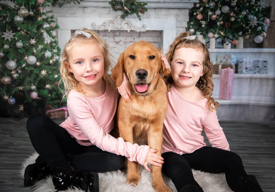 Christmas photos of two girls and their puppy