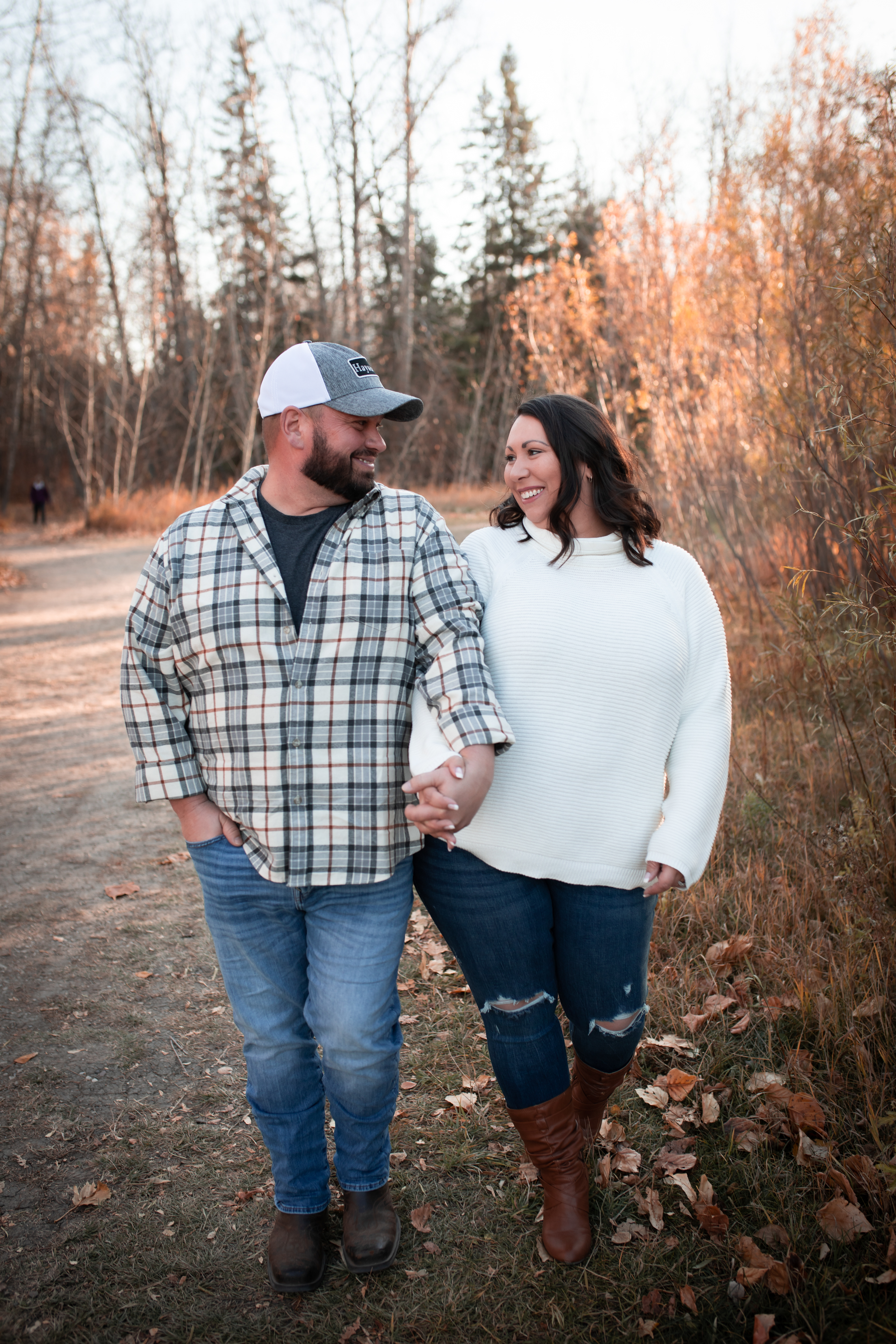couple walking and laughing Edmontons best engagement photographer