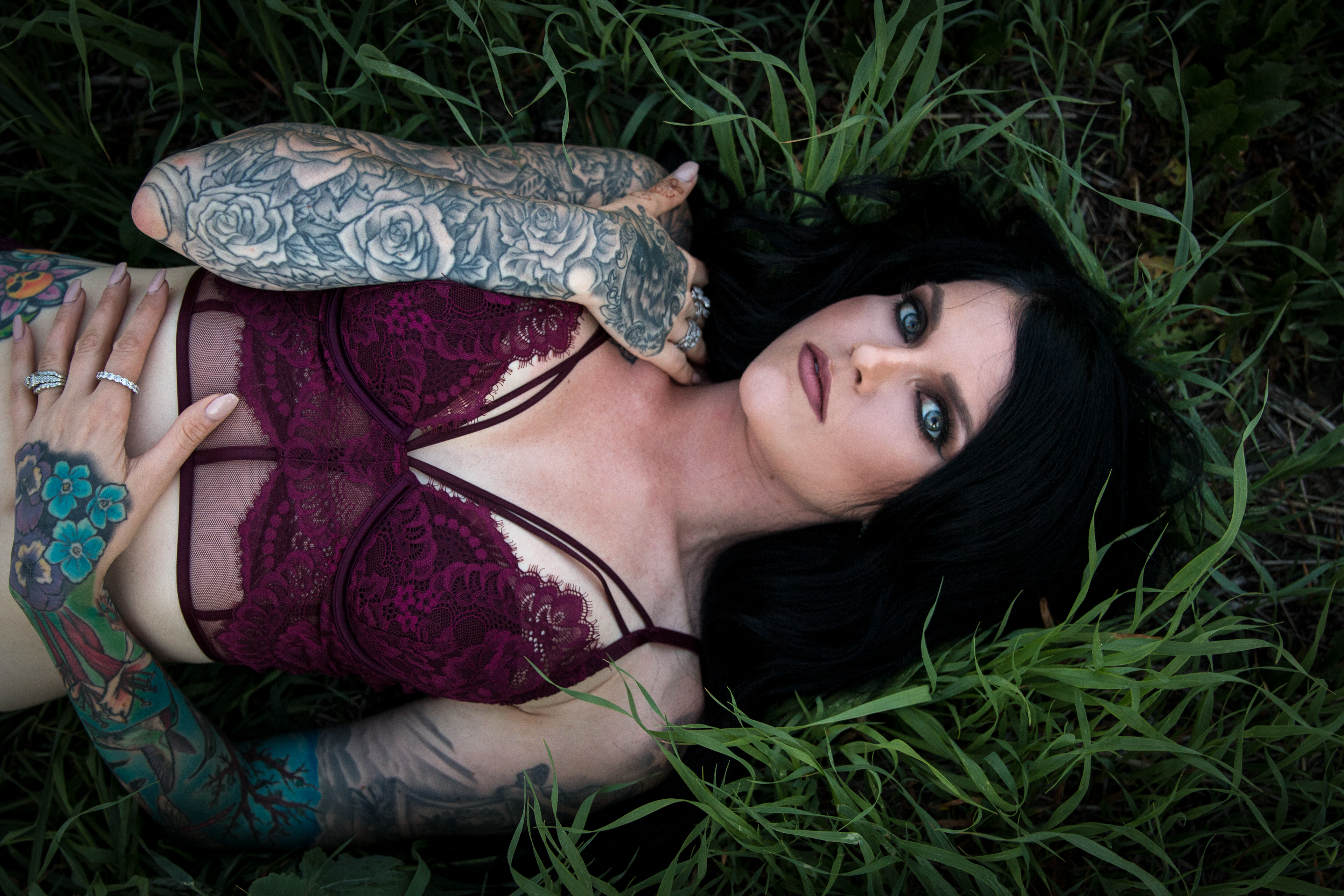 model laying in grass