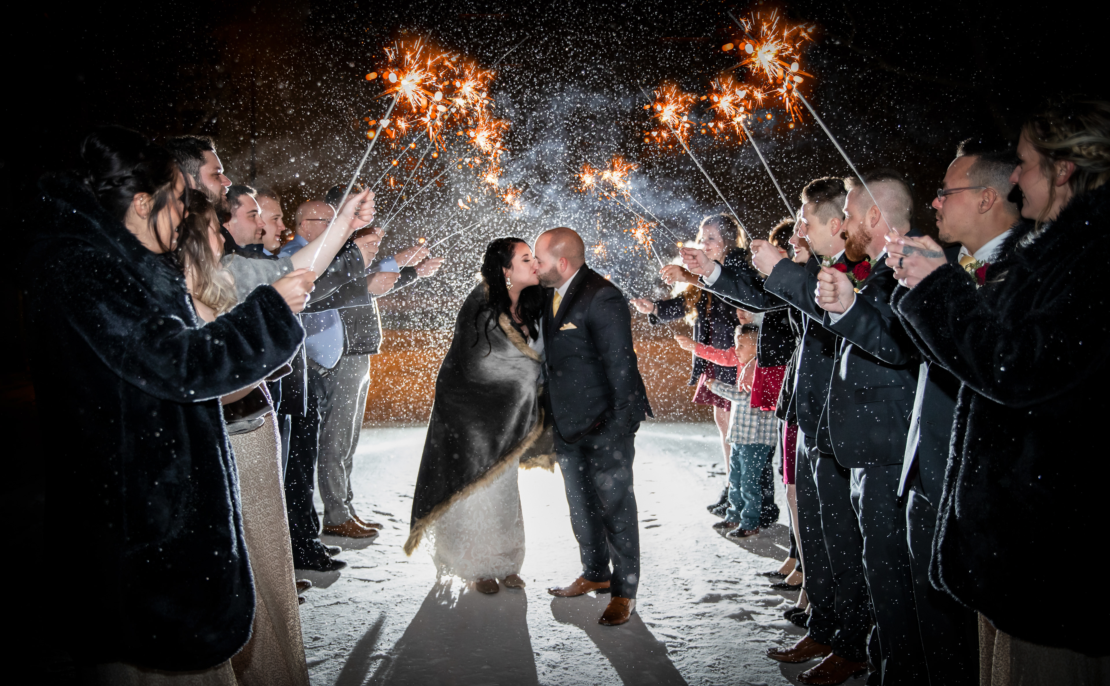 Bride and groom in the winter with sparklers in Edmonton