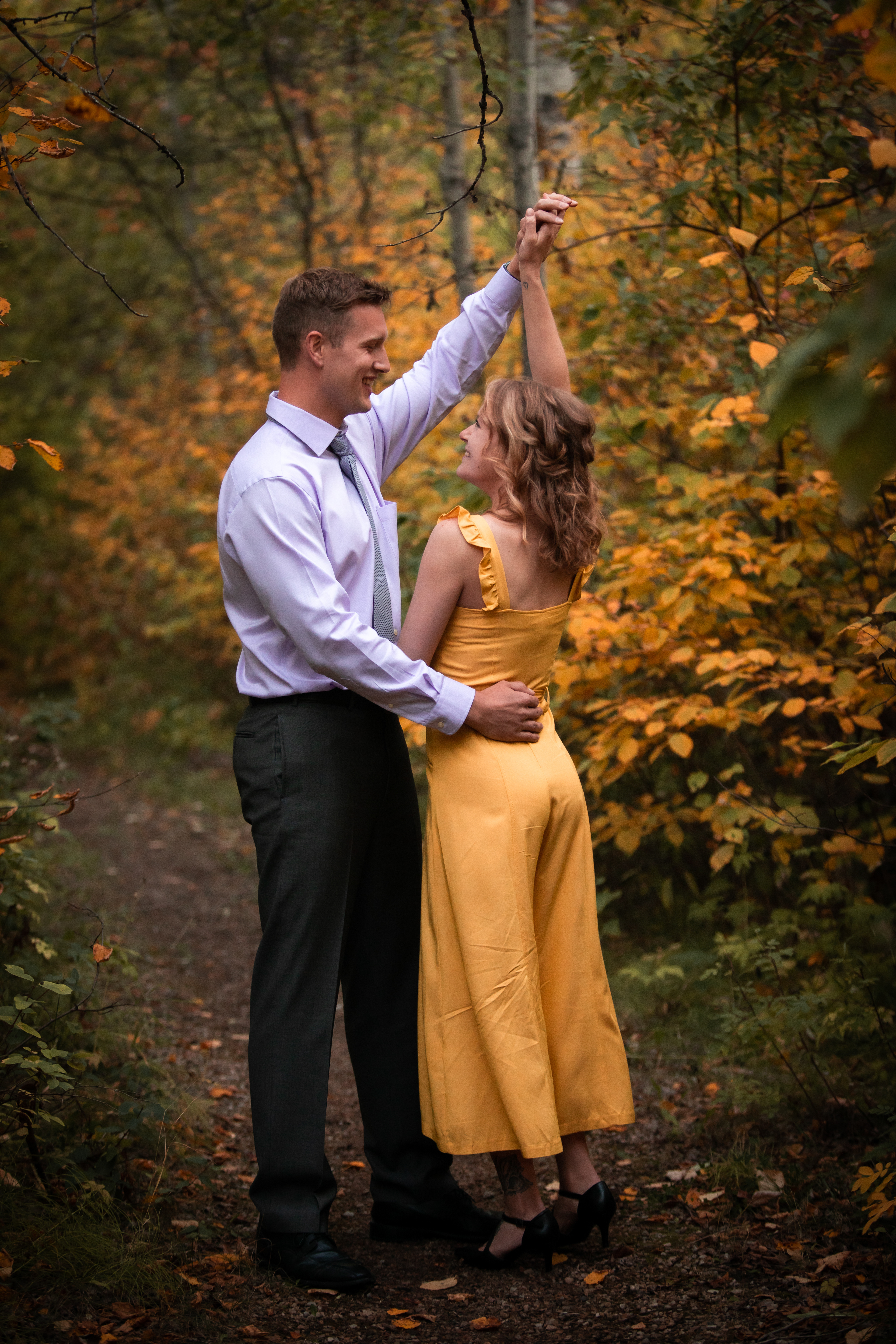 couple dancing in the forest 