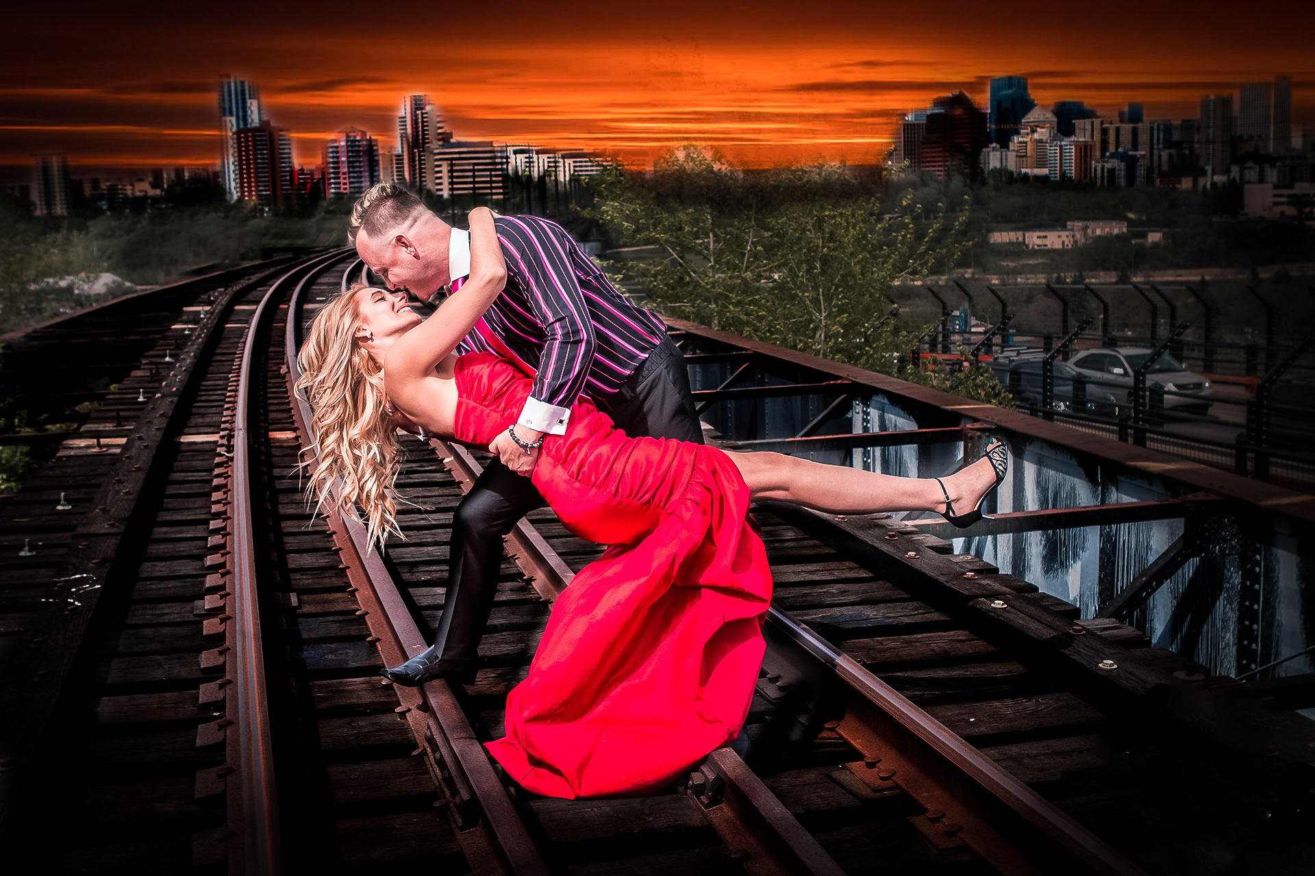 train track photo of engaged couple 