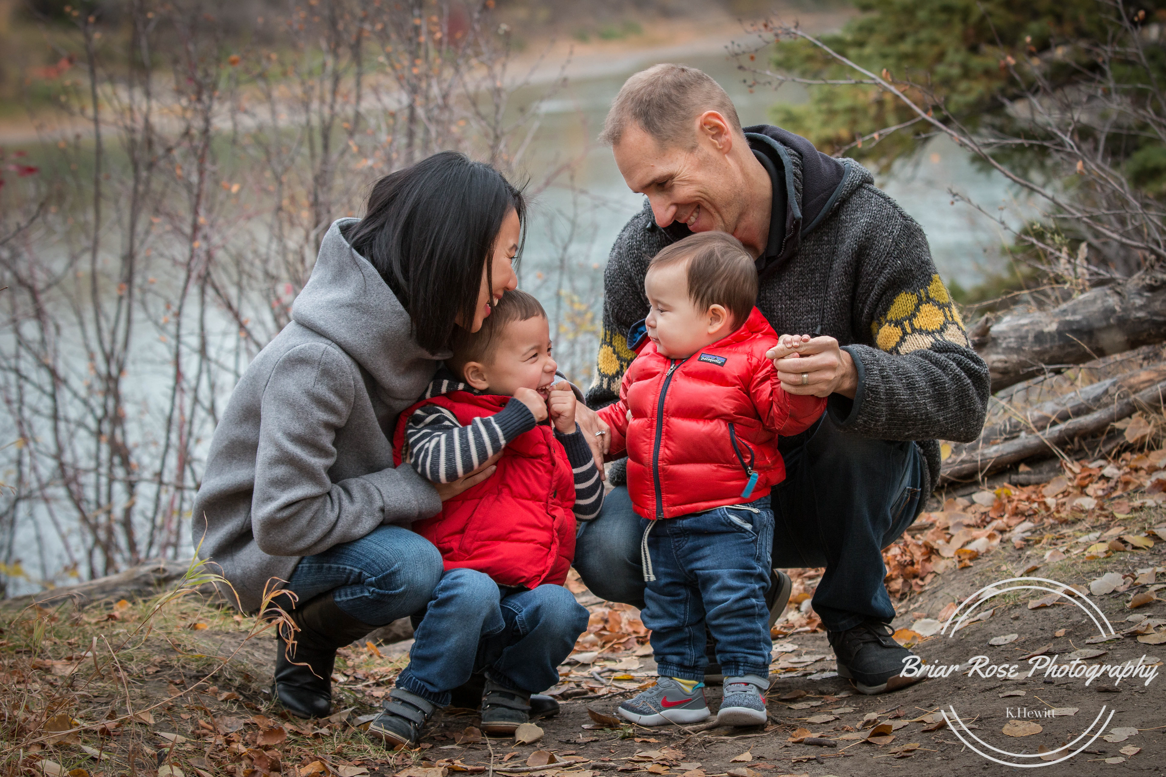 Family of four laughing