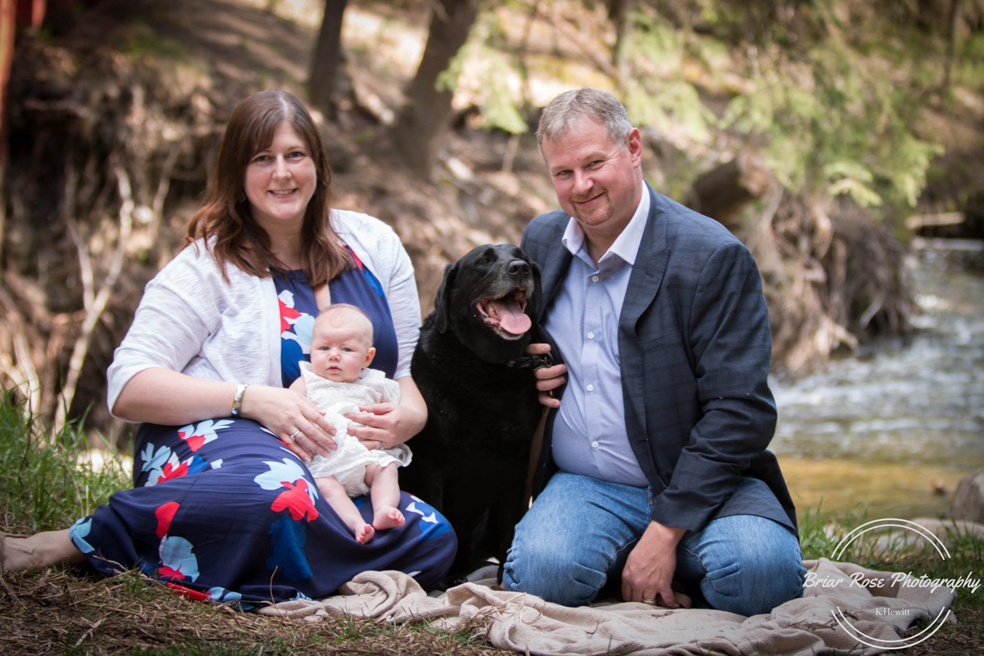 Family photo by water
