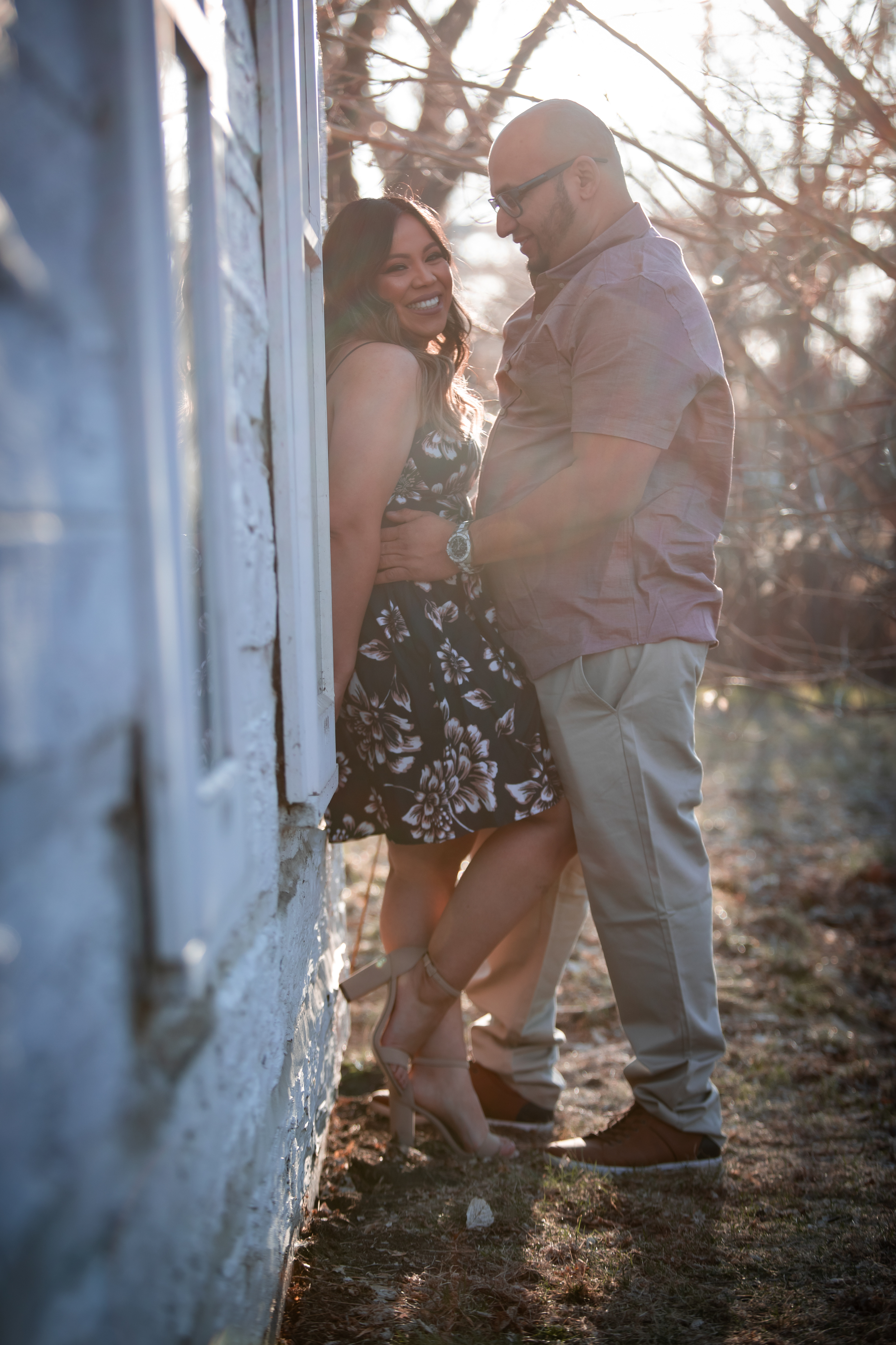 man looking at woman and woman is laughing at camera