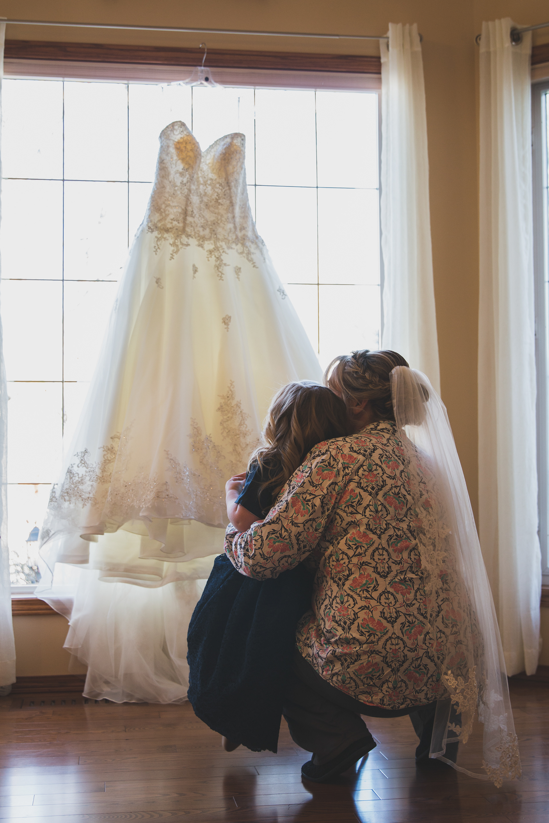 Bride and daughter looking at wedding dress in Edmonton