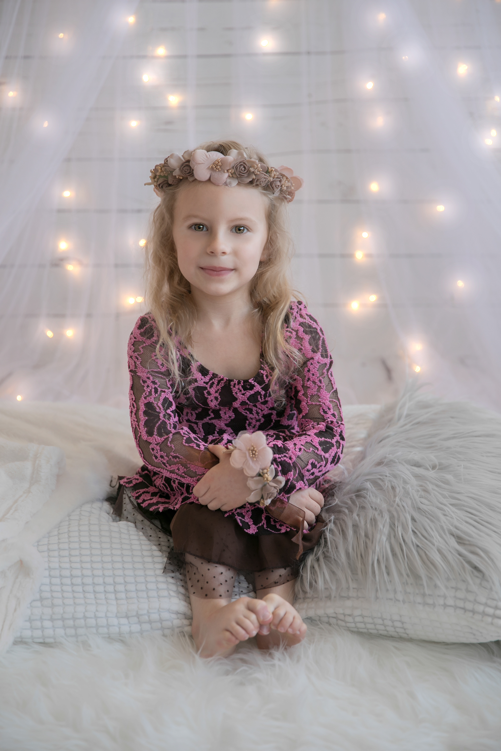 little girl smiling at the camera in edmonton studio