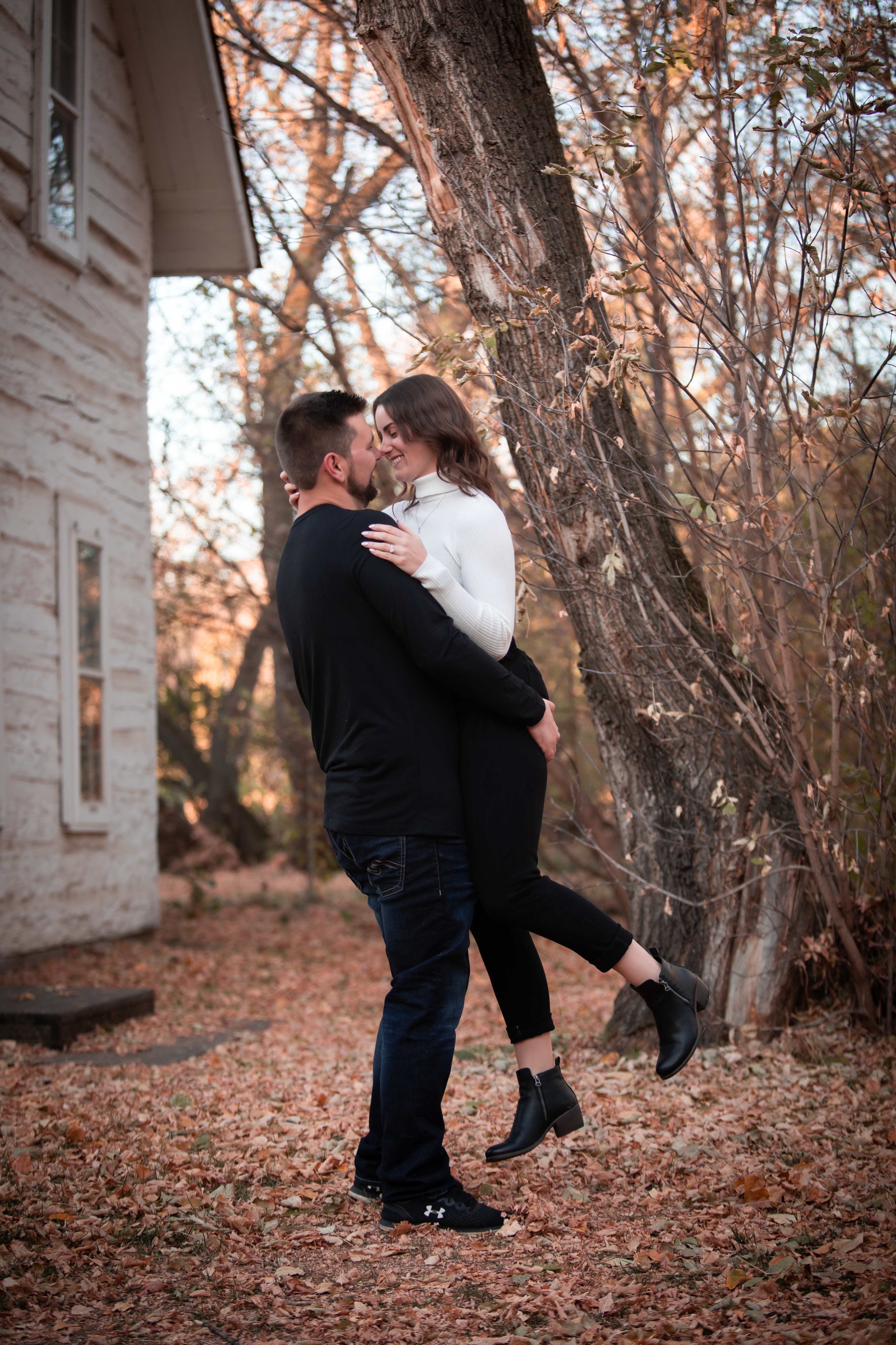 boyfriend picking up girlfriend Edmontons best engagement photographer