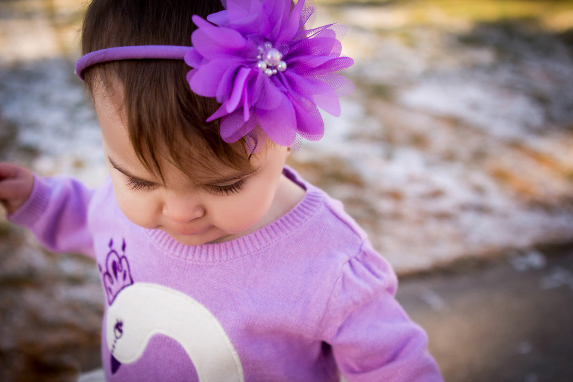 baby smiling in purple