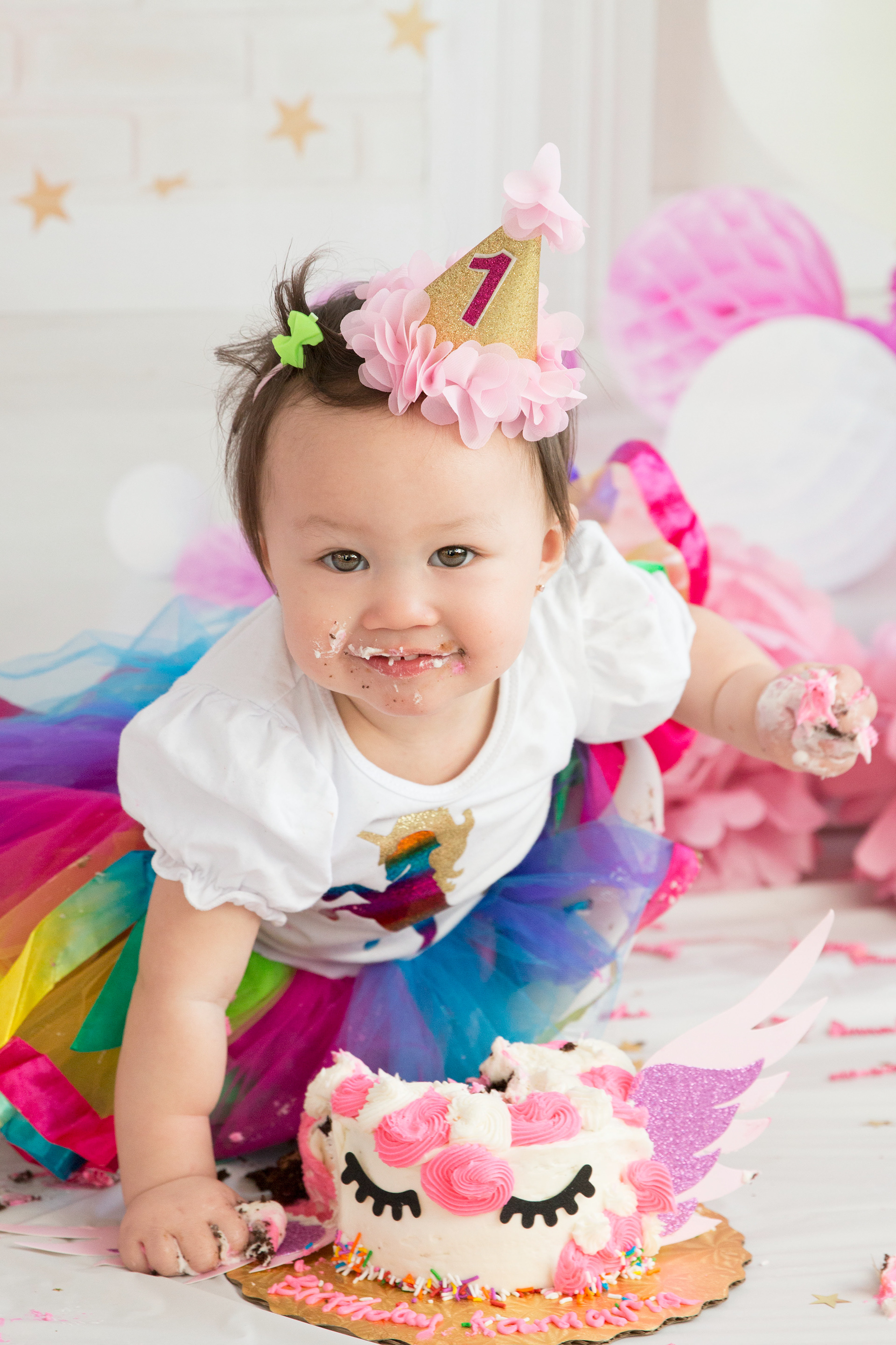 baby laughing eating cake