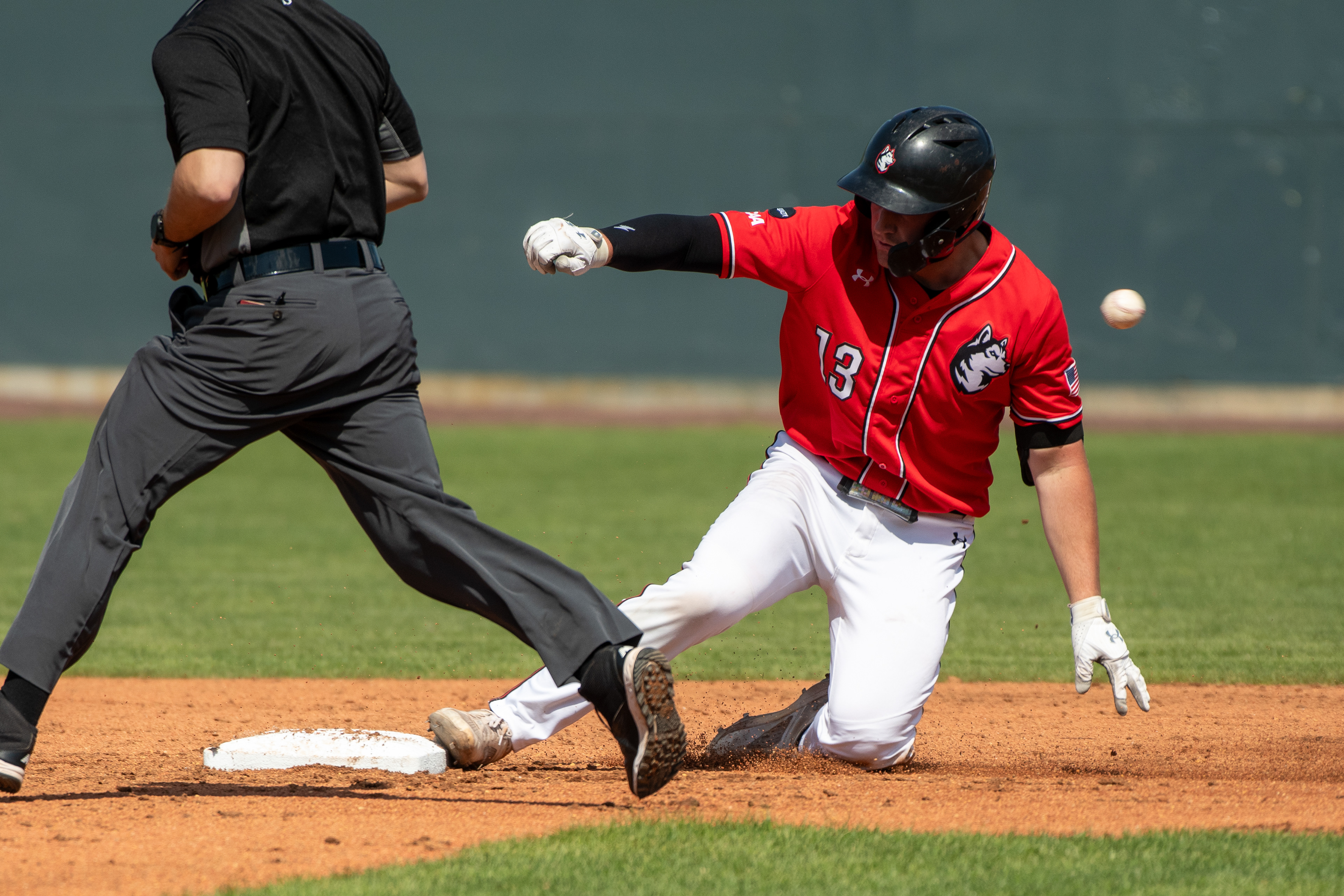 Northeastern Baseball 2024 : Matt Brinker sliding onto second base ahead of the ball