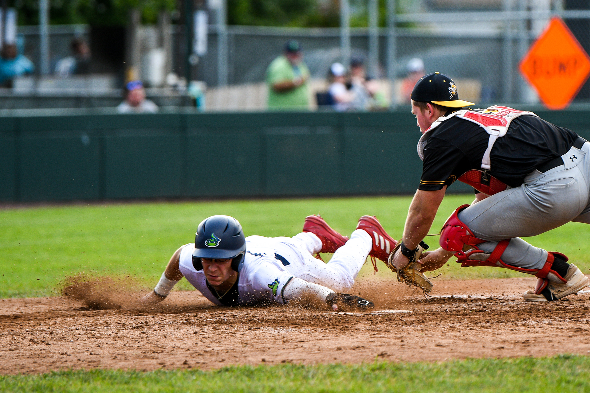 Trevor Cohen sliding into home to score for the Lake Monsters