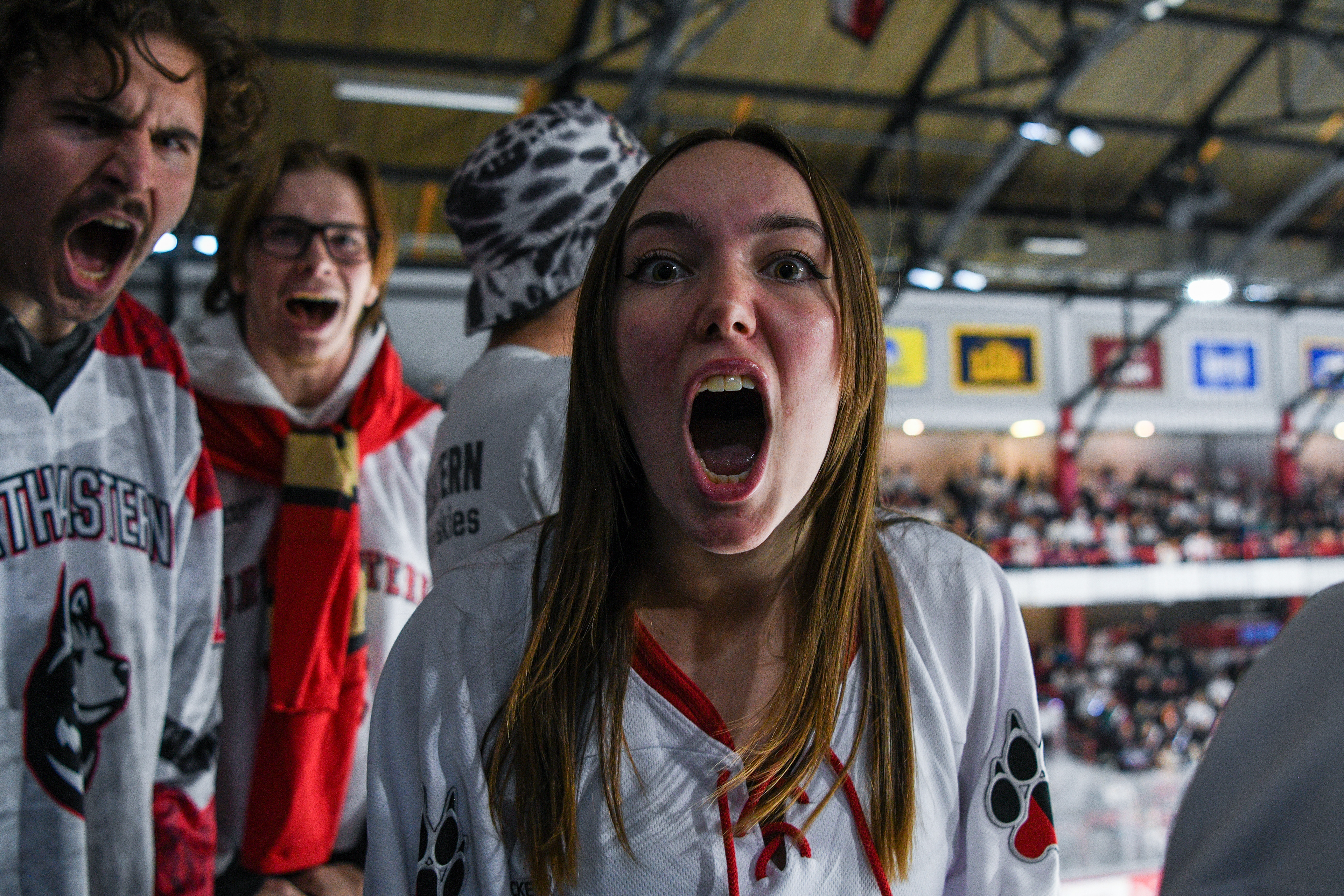 Lauren Kaufman and fellow Dog House members at the White Out game against BC, December 02, 2023