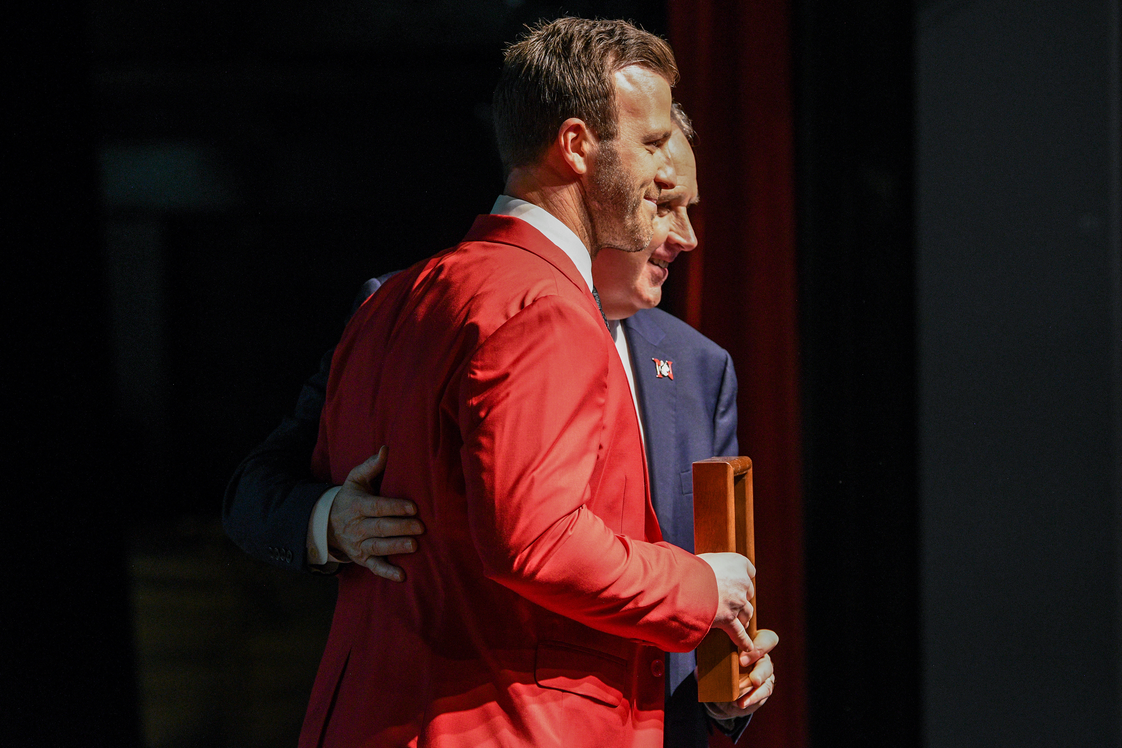 Joey Vitale receiving his 2023 inductee award from Jim Madigan