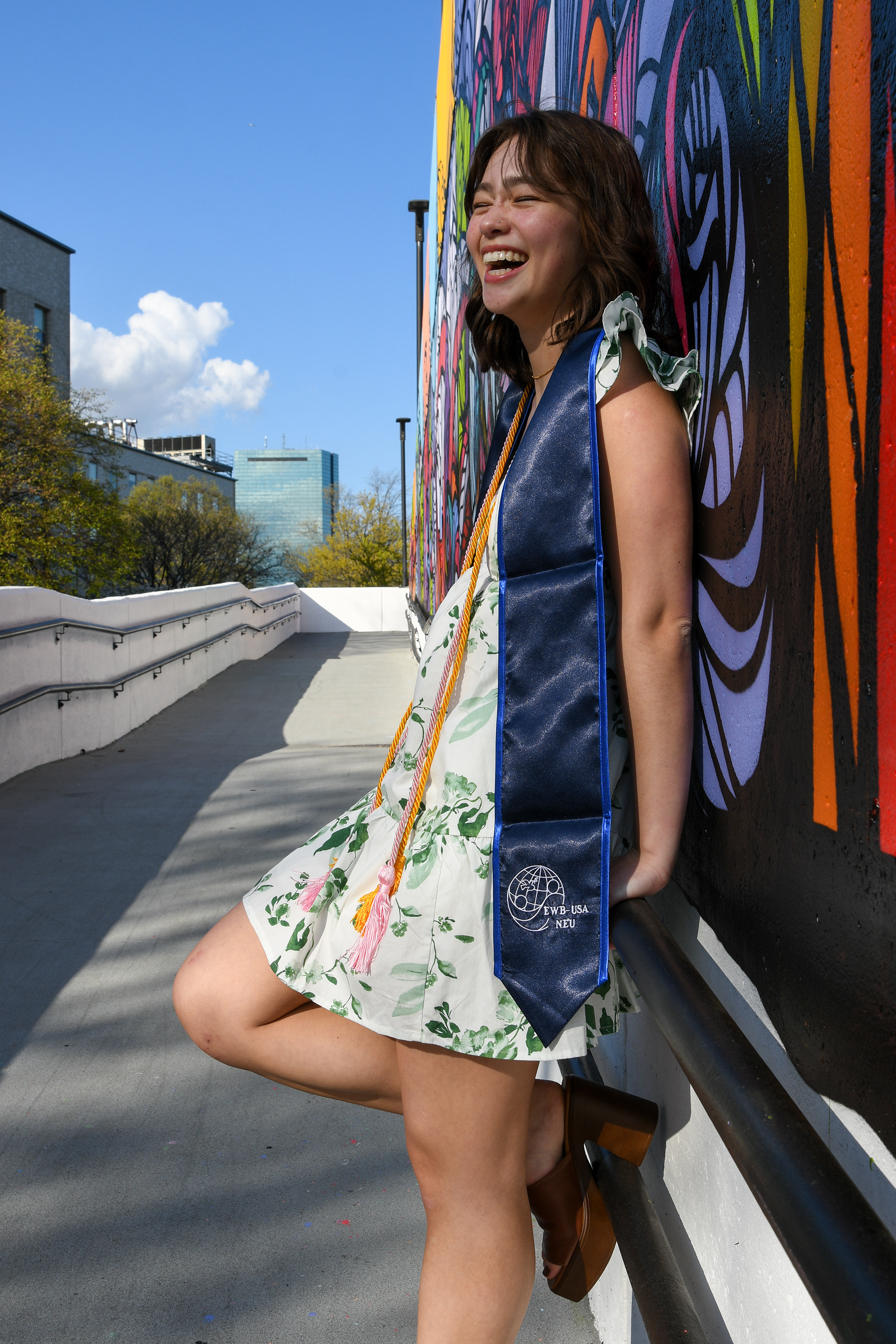 Emily Moore, class of '23, in front of the painted mural