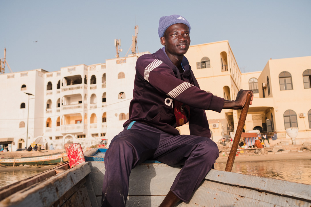 Ndiawzo,23, is as piroguiere. He transports people on Senegal River by his pirogue (canoe) between the banks of Saint-Louis island and the Langue de Barbarie.