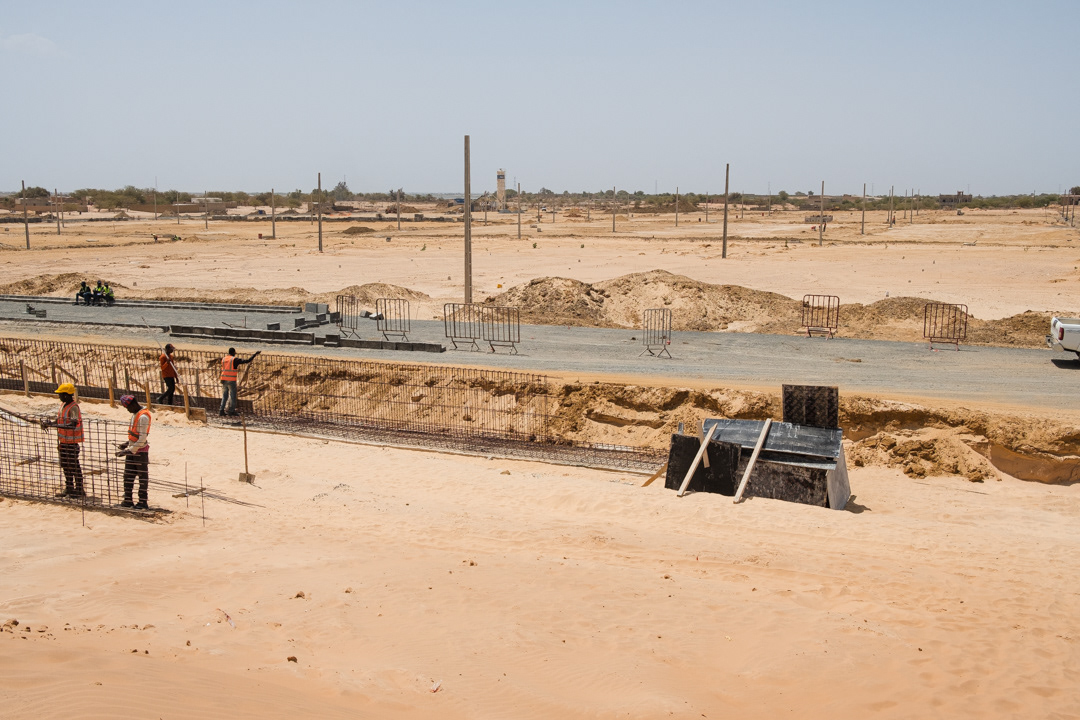 Next to Djougop temporary camp, 600 housing are planned to be built to accommodate displaced people living within the 20-meters-wide strip of the coast considered to be at high risk of flooding.