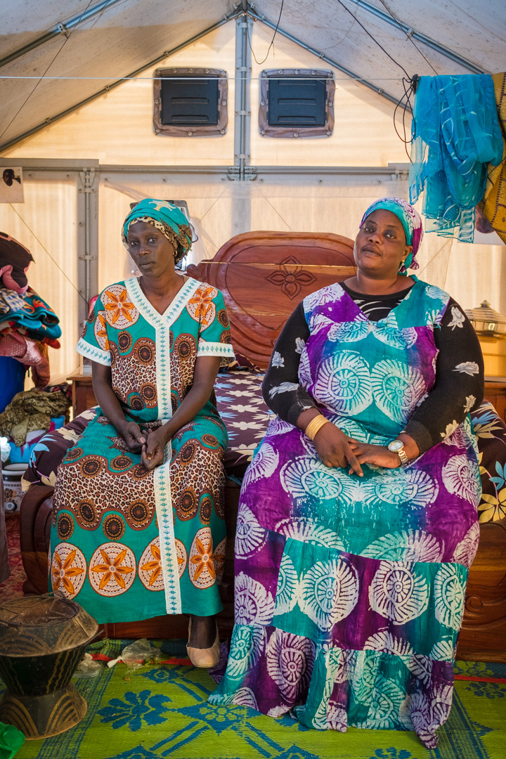 Michelle Guoye(left),50, member of the ‘Striken People Association of Khar Yalla’, with her friend Diame Seynabore Fall,39. Following a storm surge in August 2018, were moved to a school yard for two months, then in Khar Yalla. They have now been living in Djougop temporary camp for over two years.
