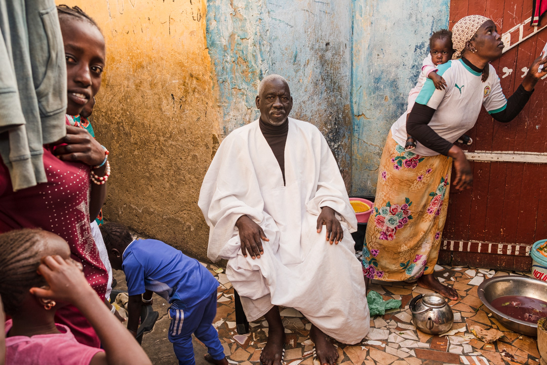 Bacare Niang (67) lives with his family within the 20-meter-wide band considered at very high-risk of flooding. ‘With the sea-wall we’ll be safe, we don’t want to leave,’ he says ‘we belong here and sea is our source of life. It provide us food and income’.