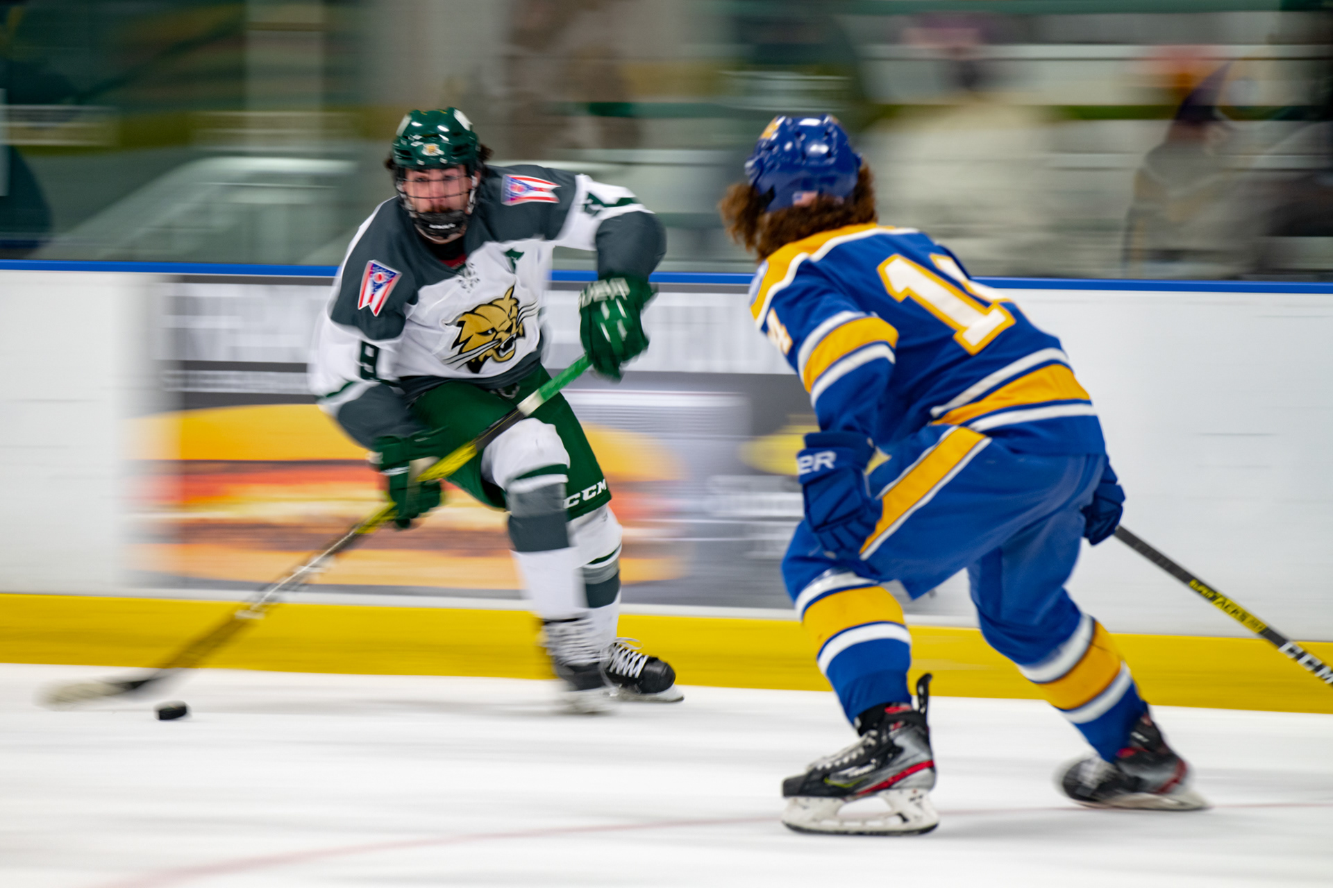 Ryan Higgins (9), a forward for the Ohio University Hockey Team, carries the puck down the rink towards the Panthers goal in their game against the University of Pittsburgh at Bird Arena on Oct. 2, 2021. The Panthers went to win the game 5-2.