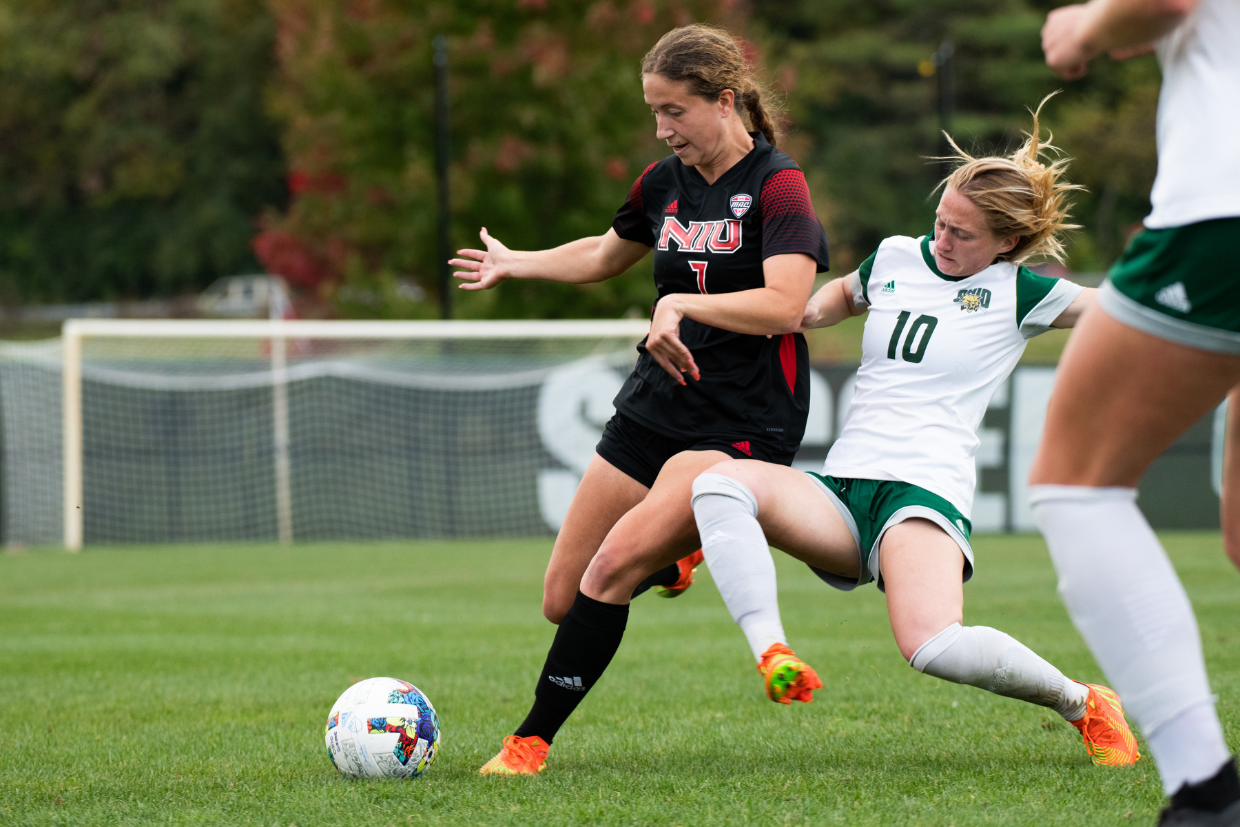 Haley Miller slide tackles Aubrey Robertson of Northern Illinois University during their game at Chessa Field in Athens, Ohio, on Thursday, Oct. 6, 2022. The Bobcats went to tie the game 1-1. This was Miller’s last season with the Bobcats, but Head Coach Aaron Rodgers says it’s time for new players to cement their legacy.