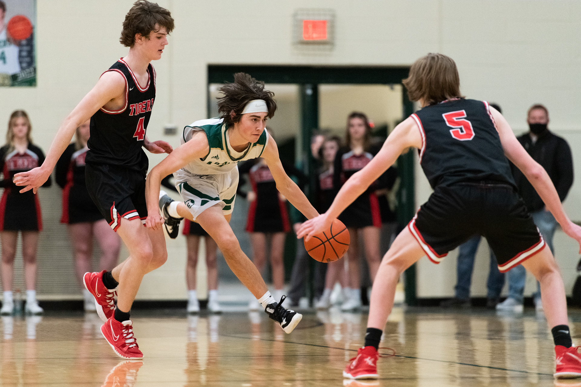 Bulldog Nathan Shadick tries to keep his balance after being fouled by Briley Cramer during their game against the Circleville Tigers at Athens High School in Athens, Ohio, on Friday, Feb. 11, 2022.