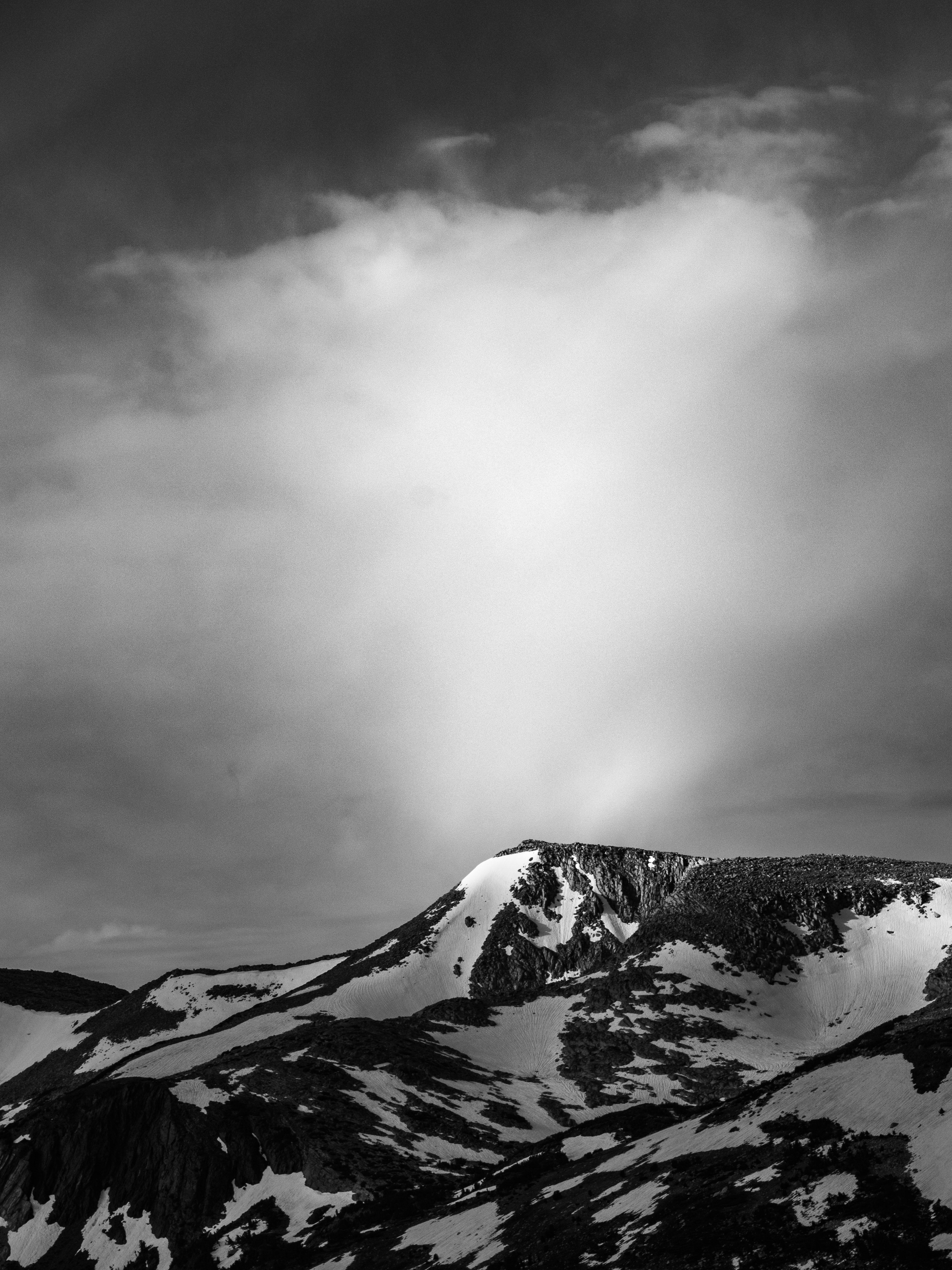 Illuminated Clouds Above a Peak
