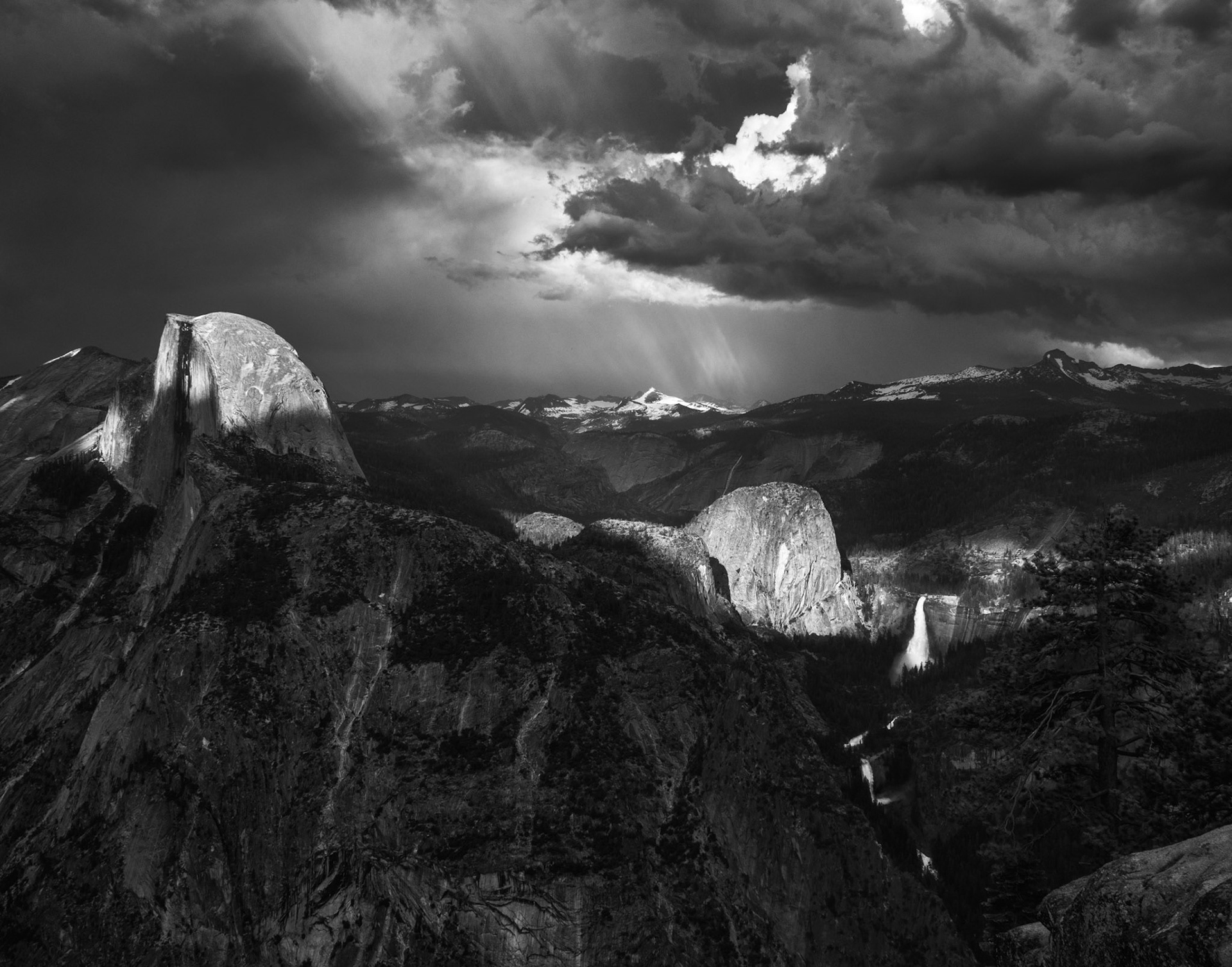 Half Dome and Liberty Cap Illuminated Through Storm Clouds
