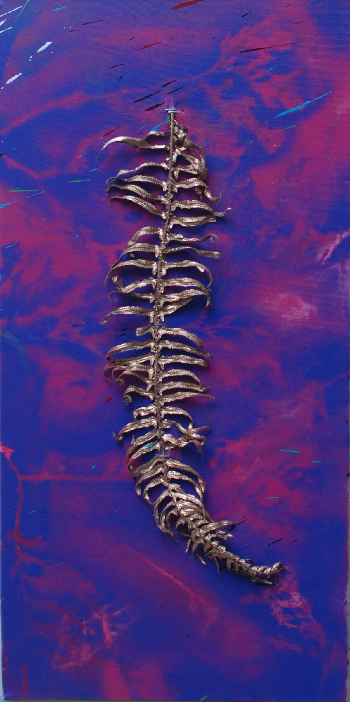 Metalic spray paint on fern attached to spray painted canvas