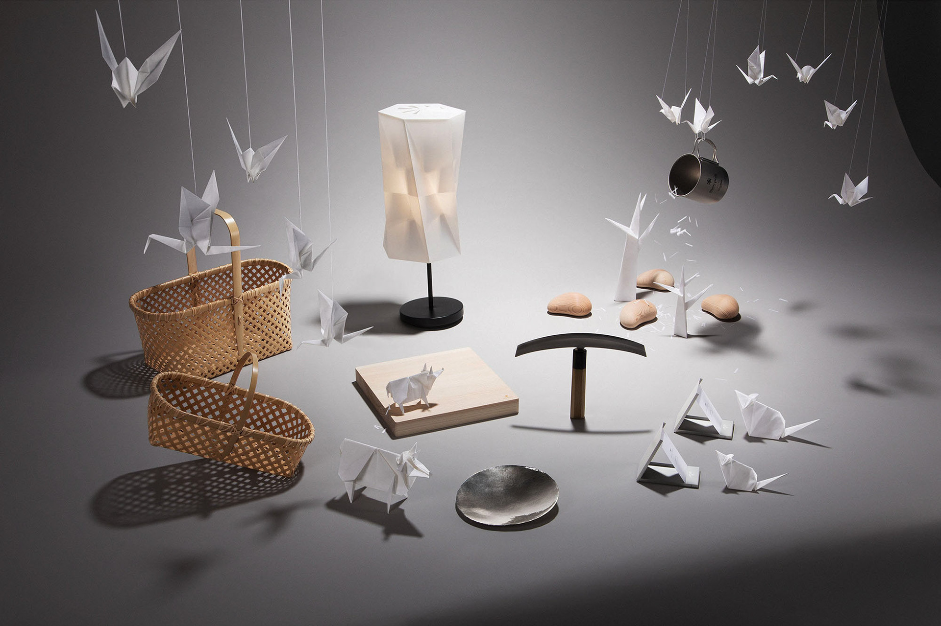 Studio image setting with Japanese design objects joined by typical Dutch animals folded in oregami