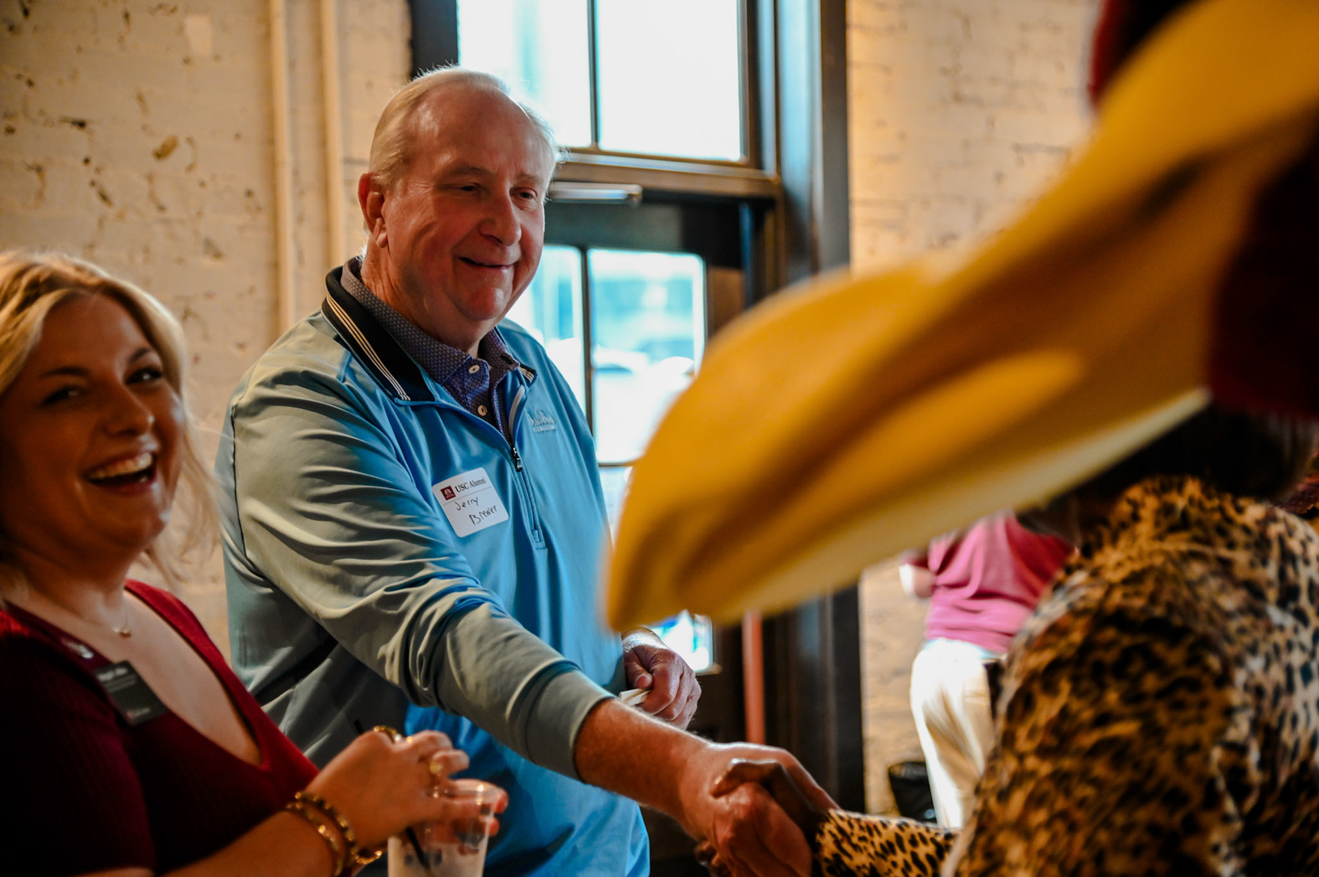 Jerry Brewer shaking hands with an unseen person