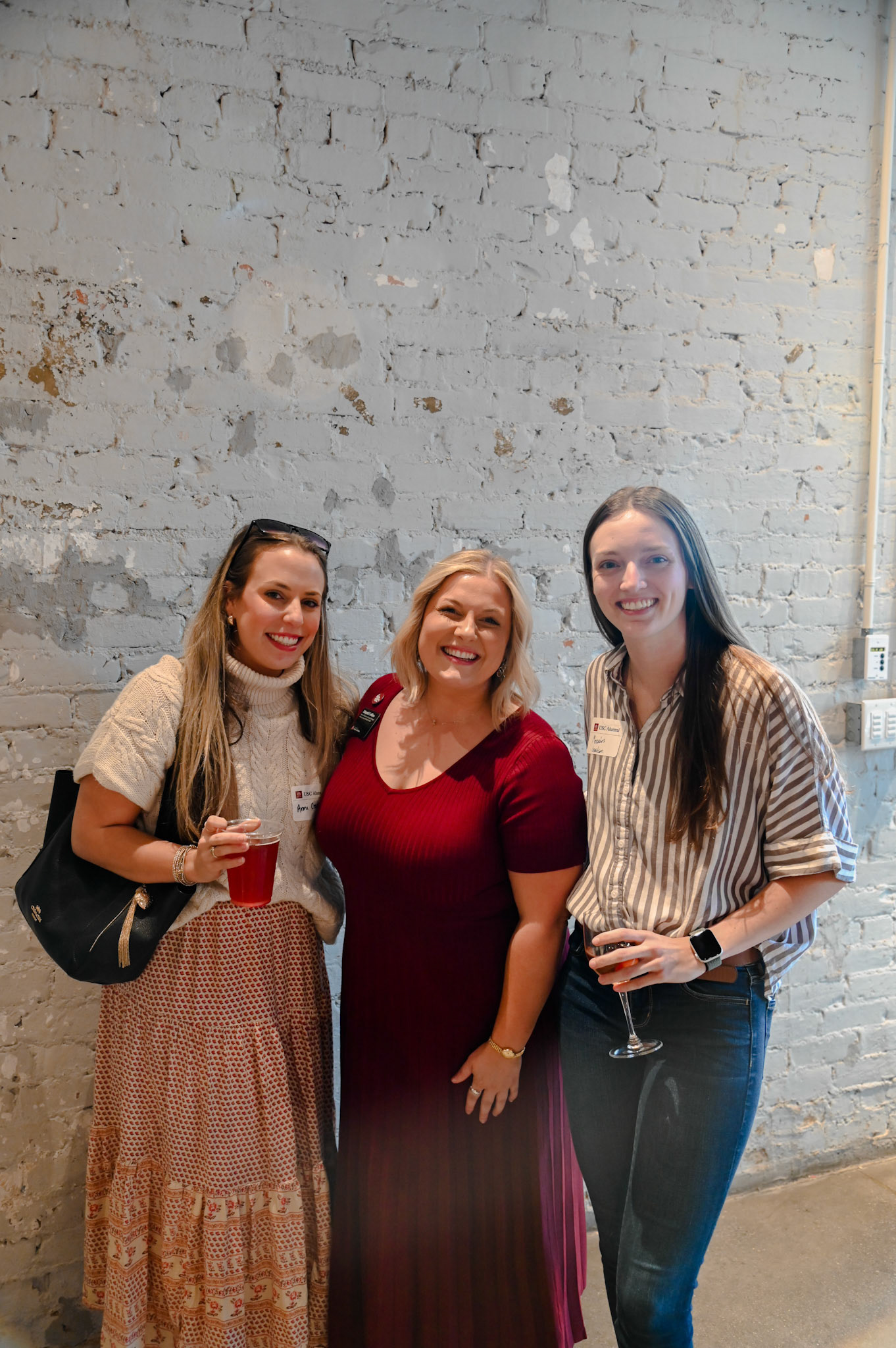 Abigail Collins posing with two alumni women