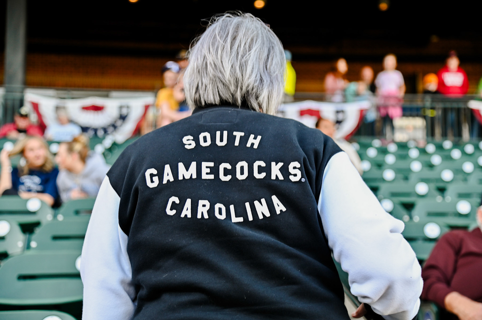 A person with their back to the camera with a jacket that reads "South Carolina Gamecocks"