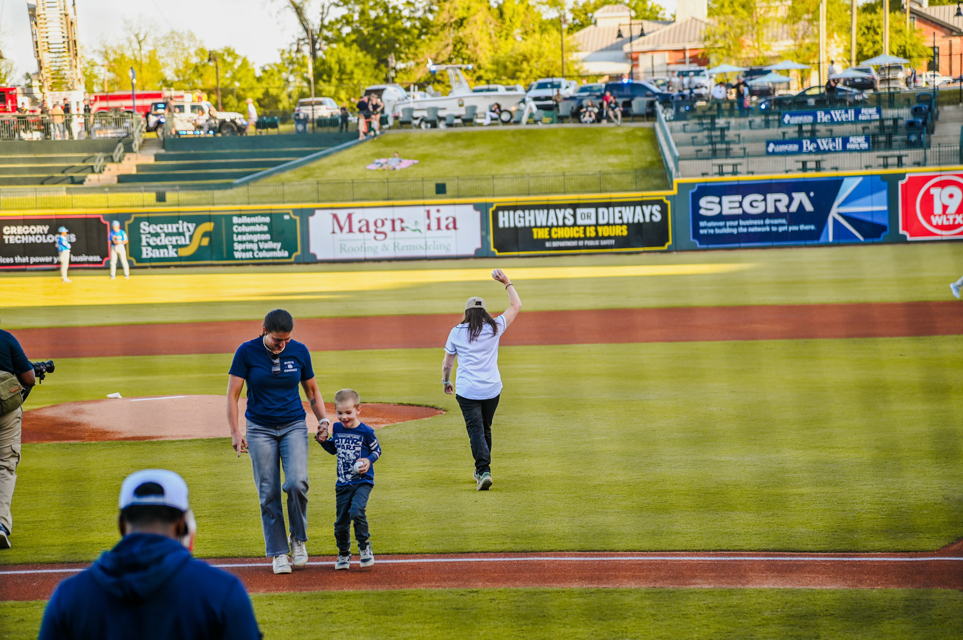 Dean Sabo-Attwood walking to the mound to throw the first pitch of the game.