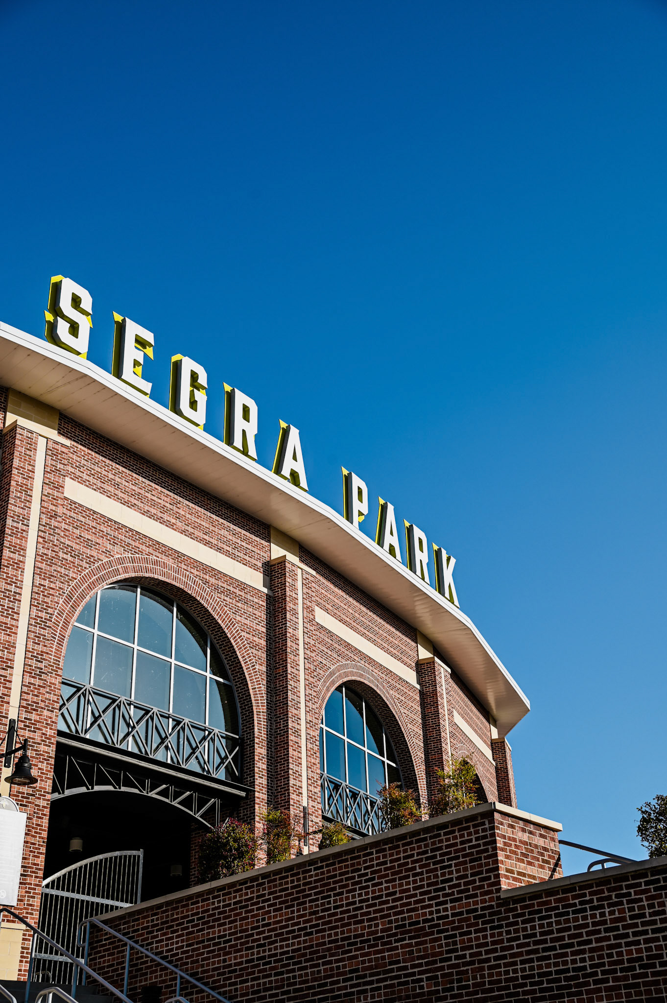 Exterior view of Segra basepale park sign against a blue sky