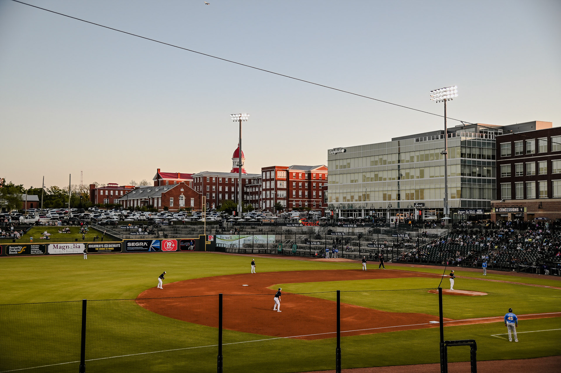 View of the baseball game with the red cupola of the Babcock building in the background
