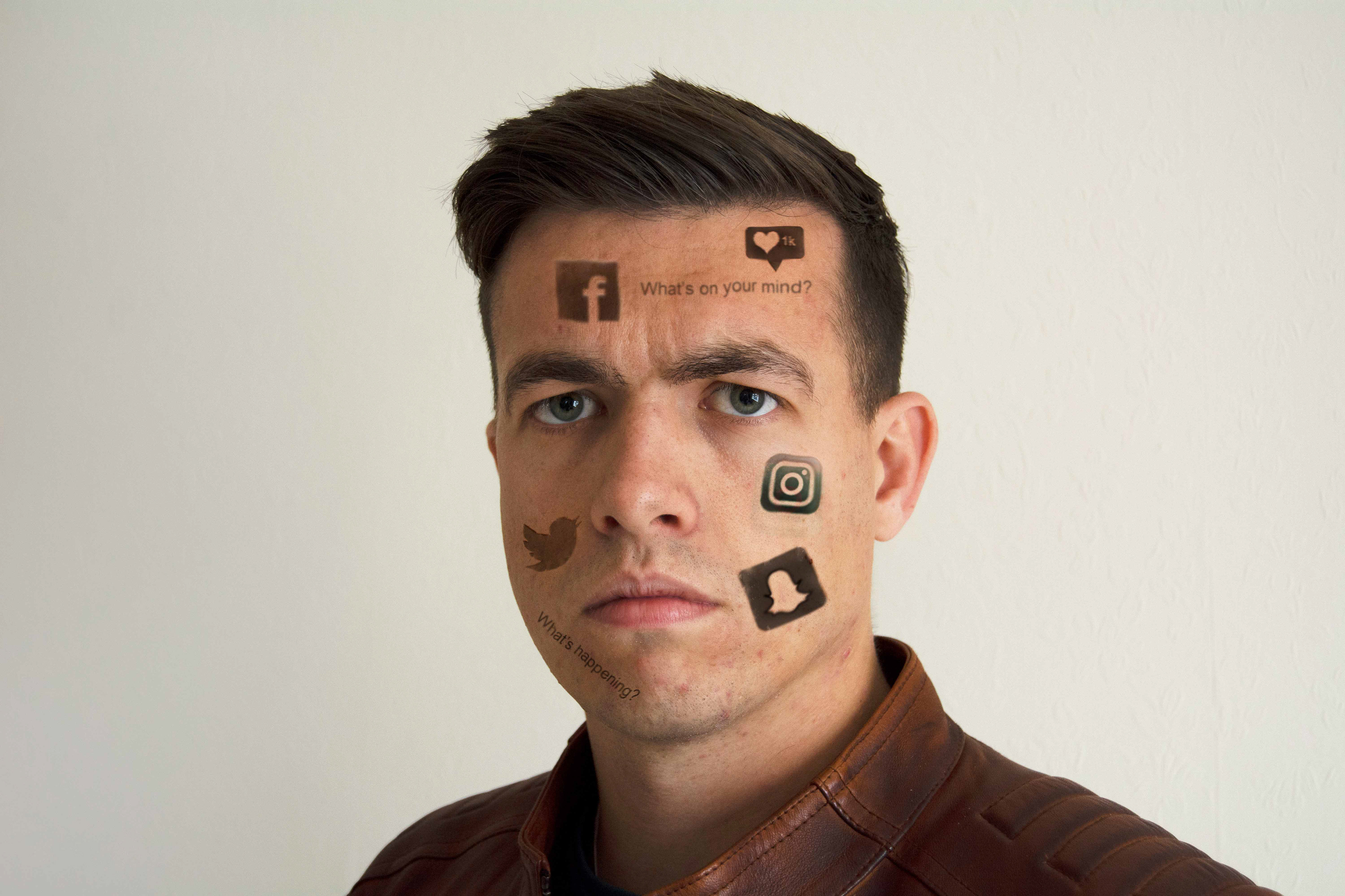 Man covered in social media logos and slogans.