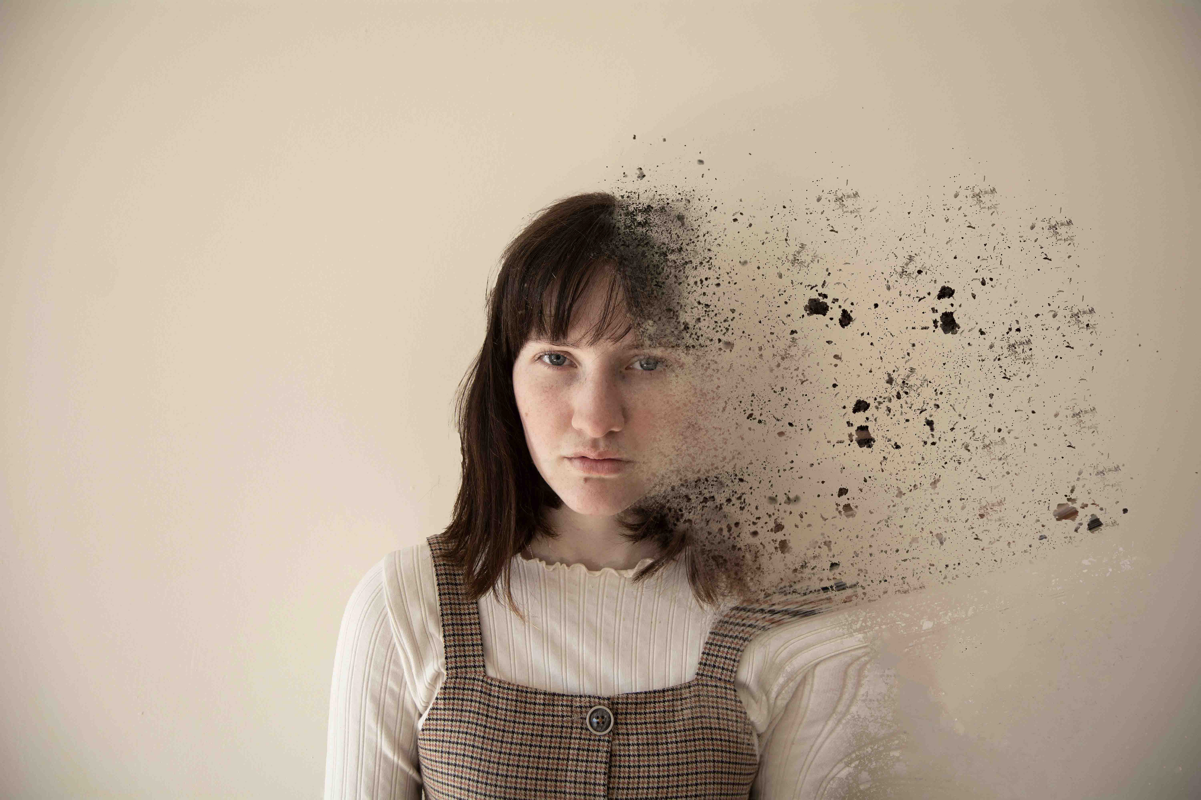 Woman begins to disintegrate.