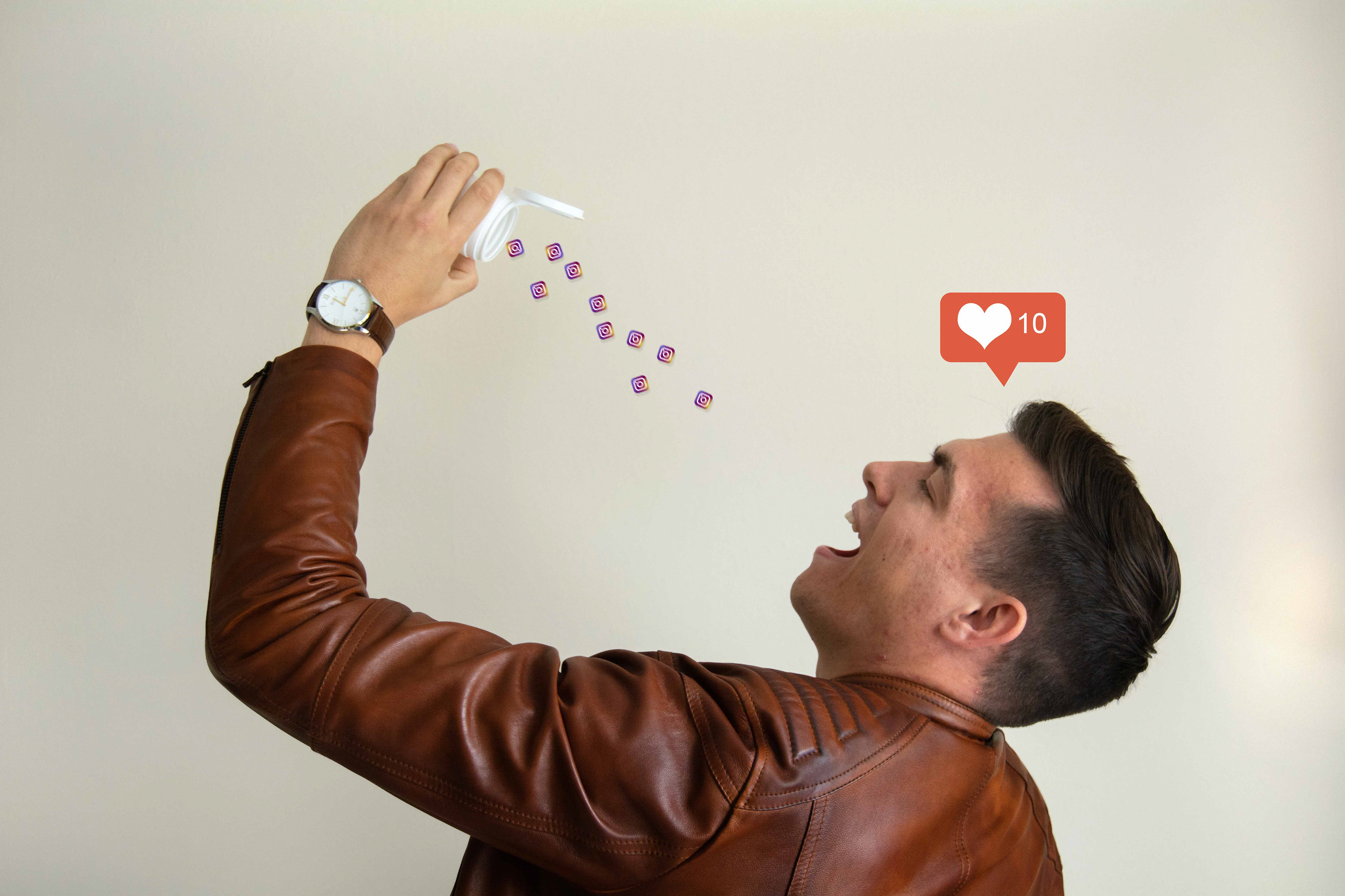 Man drinks Instagram logos from bottle.