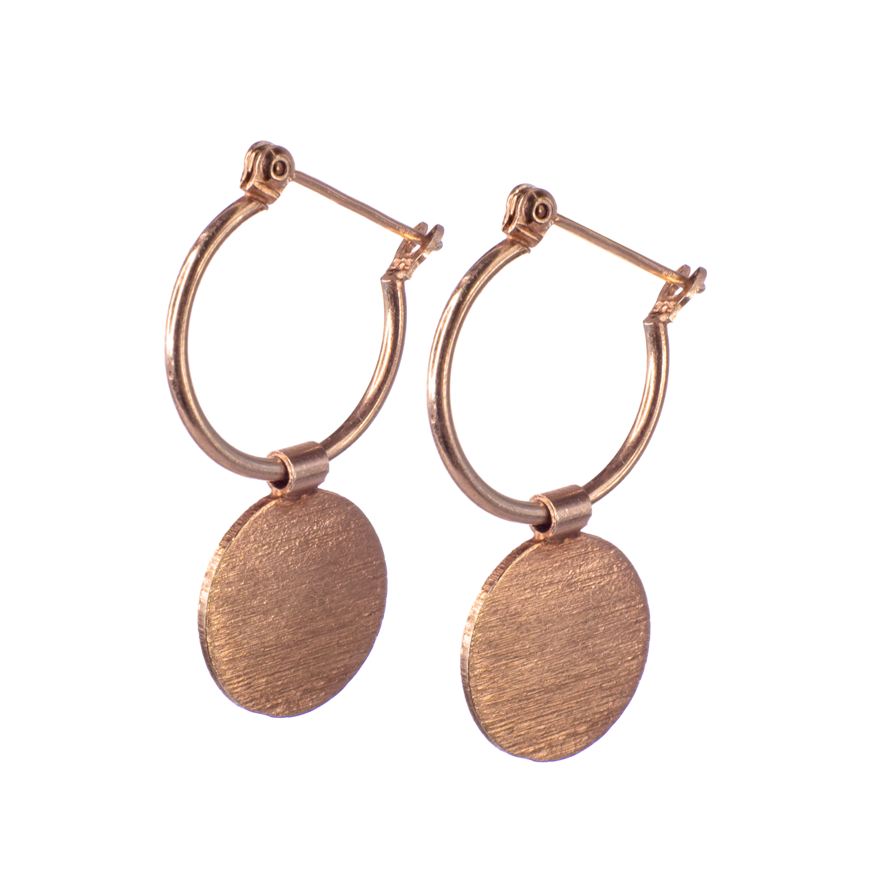 Flashgun, natural light, earrings suspended on a nylon string. Home studio.
