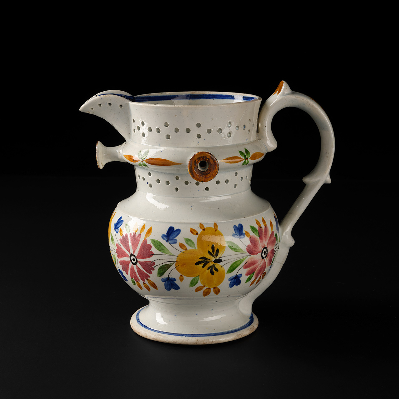 Earthenware puzzle jug, made by the Musselburgh Pottery, 1836