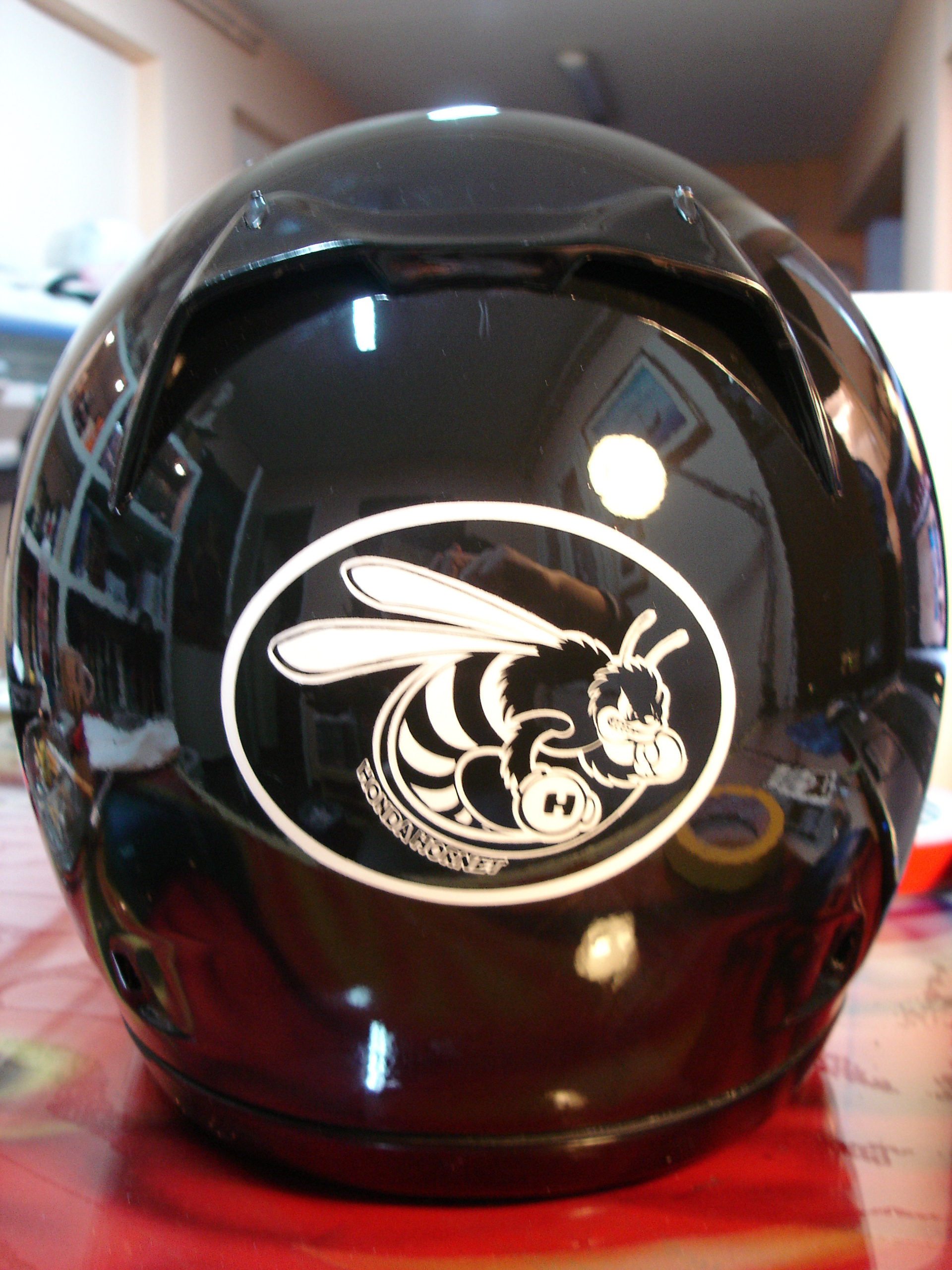 Arai helmet with a custom airbrushed Honda Hornet design 