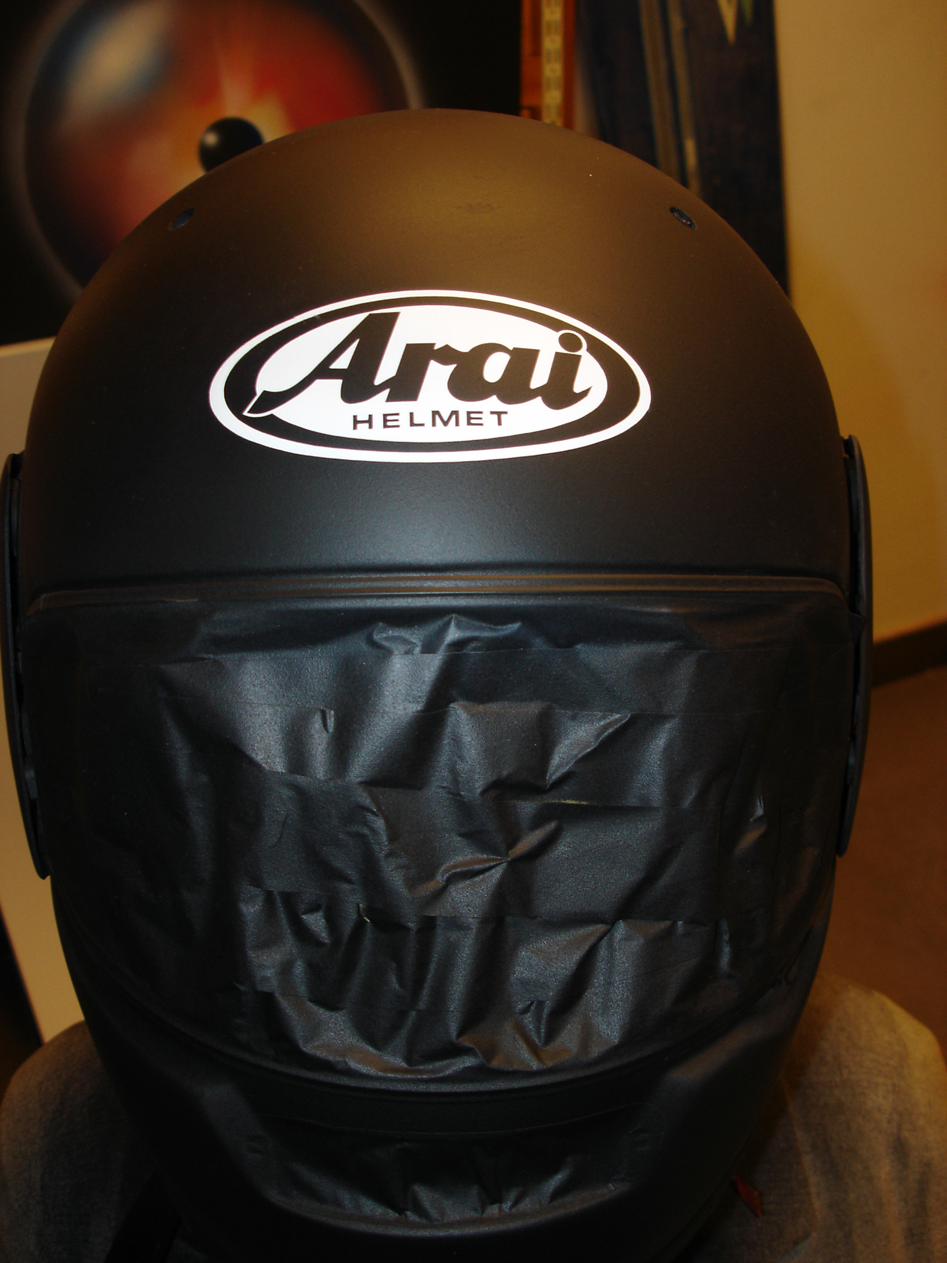 Arai helmet with a custom airbrushed Honda Hornet design 