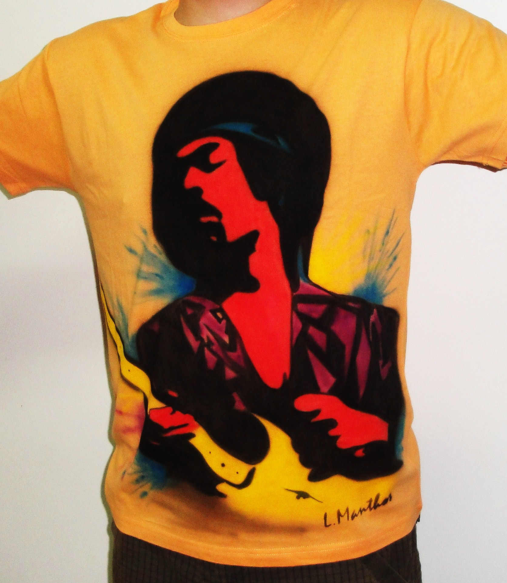 Jimi Hendrix (airbrush on yellow t-shirt)