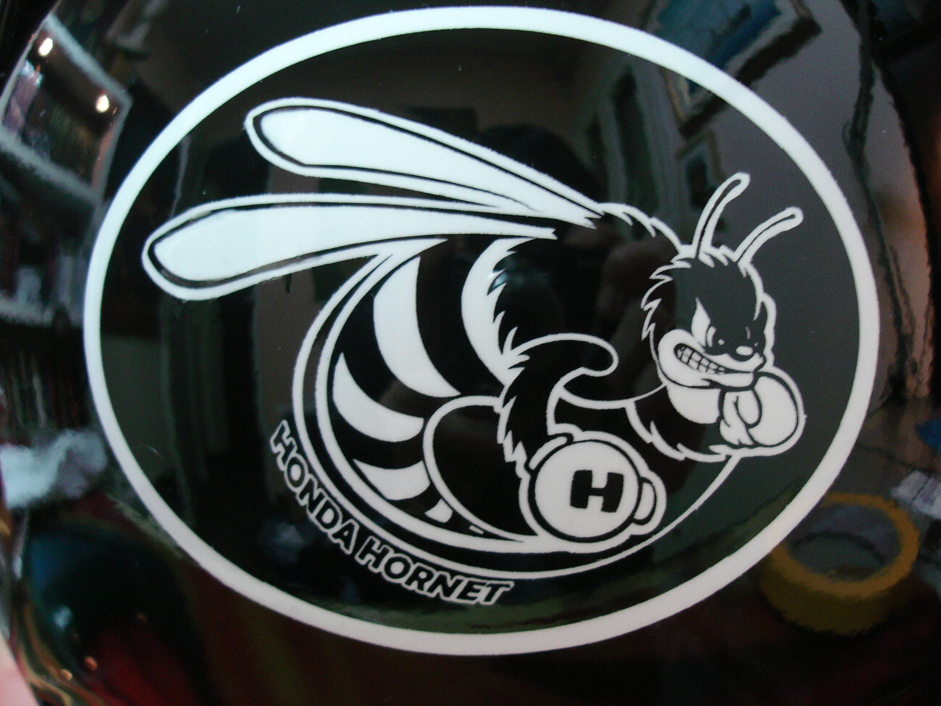 Arai helmet with a custom airbrushed Honda Hornet design 