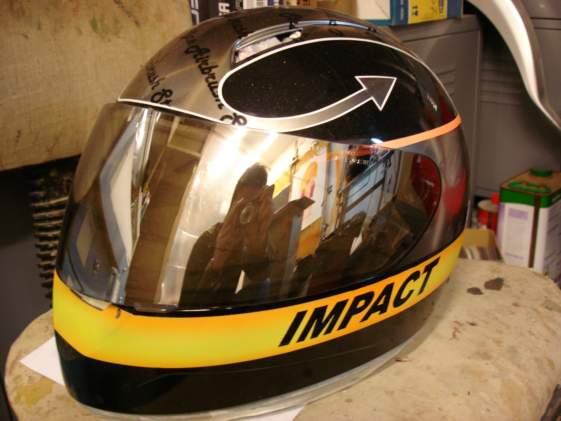 Chrome-effect impact logo airbrushed on helmet