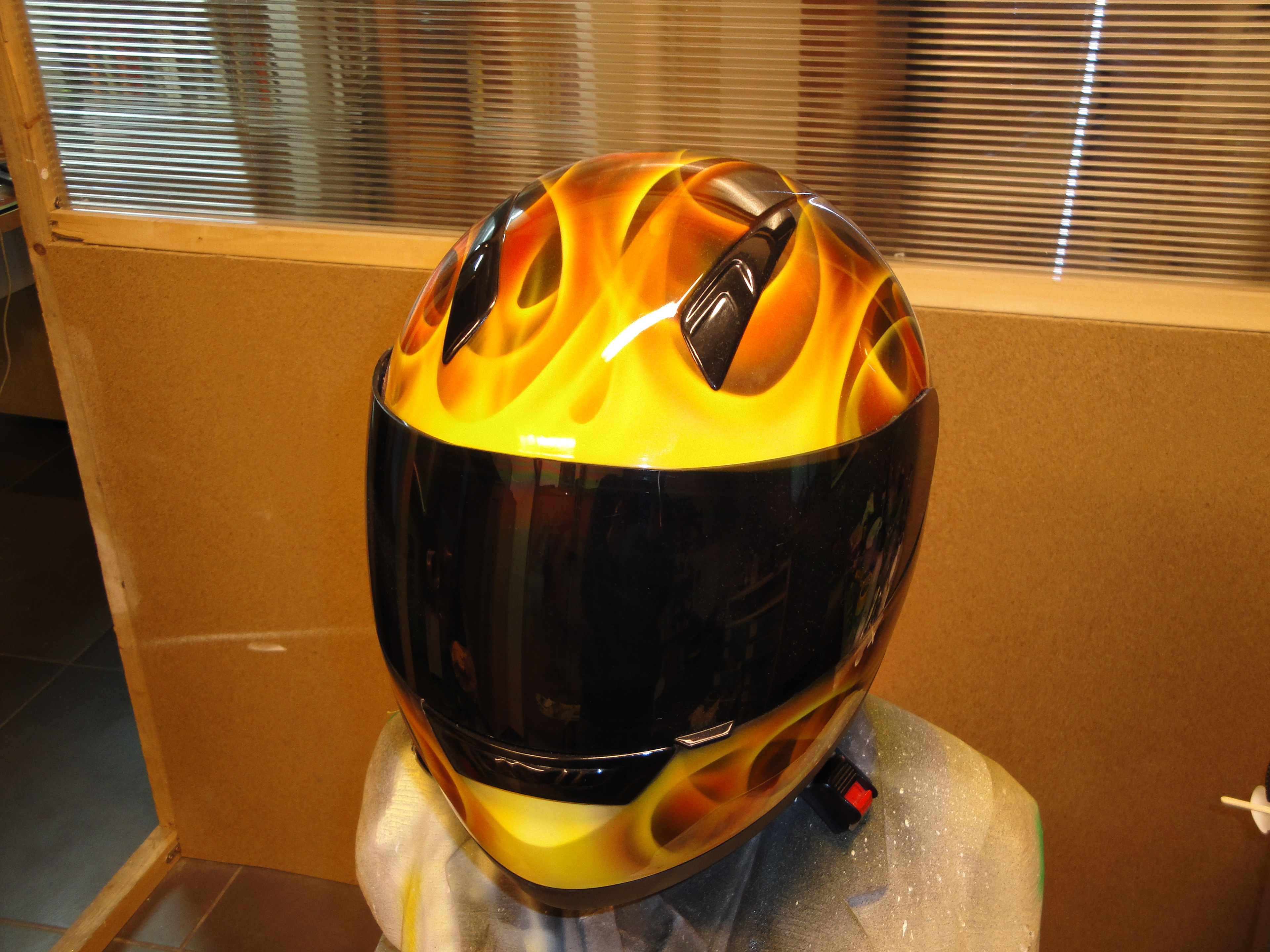 Realistic flame airbrush design on helmet