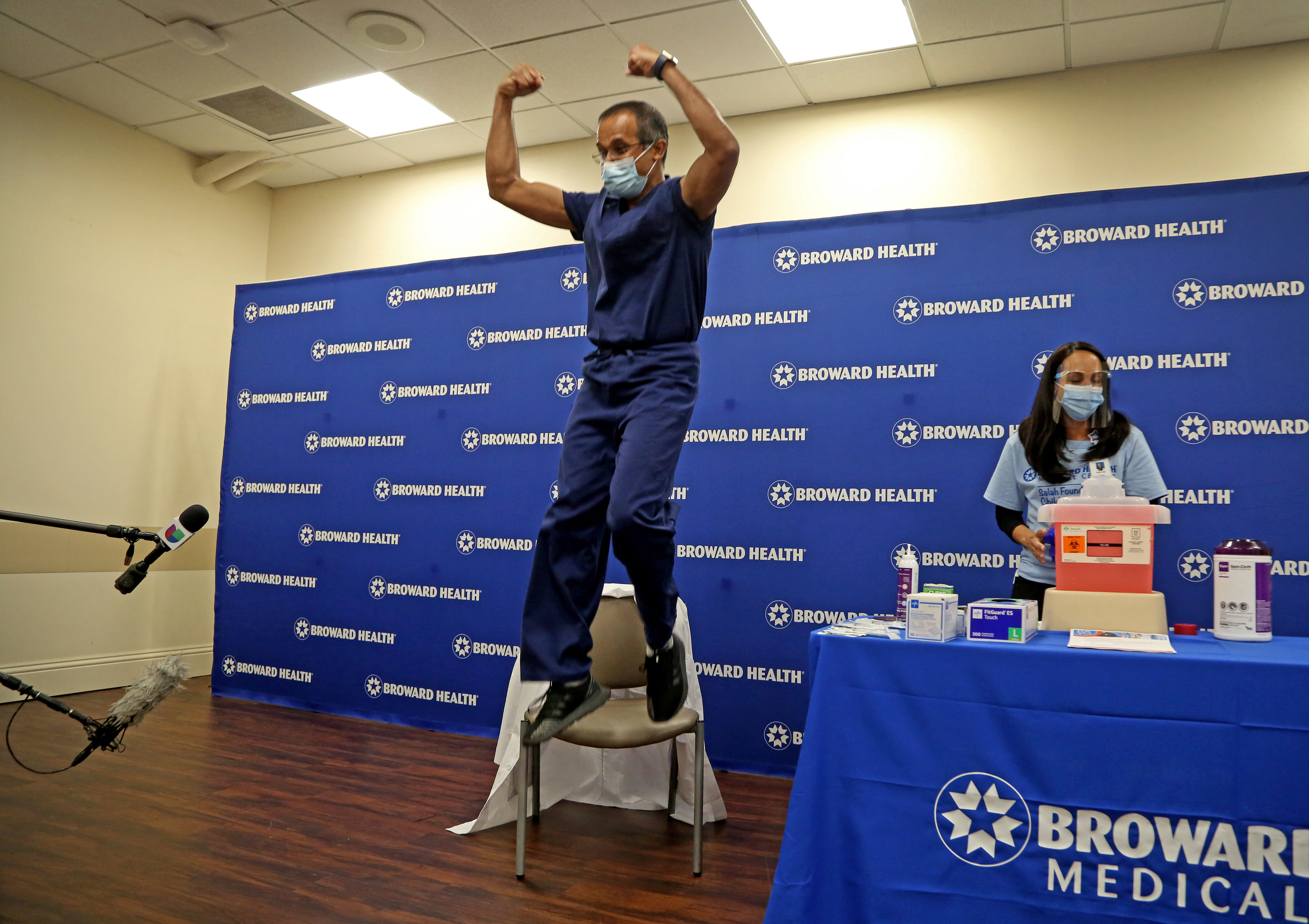 A physician celebrates being the first doctor at Broward Health Medical Center in Fort Lauderdale to receive the Pfizer COVID-19 vaccine in December of 2020. 