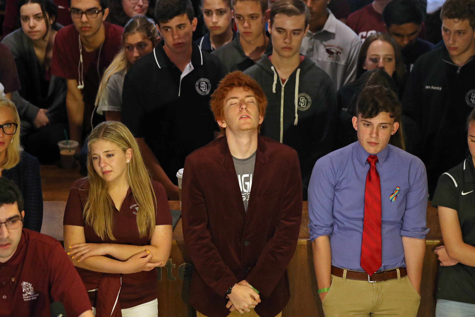 Marjory Stoneman Douglas High students Jaclyn Corin, Ryan Deitsch and Alfonso Calderon become emotional as they listen to a fellow student recalling the day of the mass shooting where 17 were killed.  One hundred students from the Parkland high school met with legislators at the state Capitol to talk about gun control.